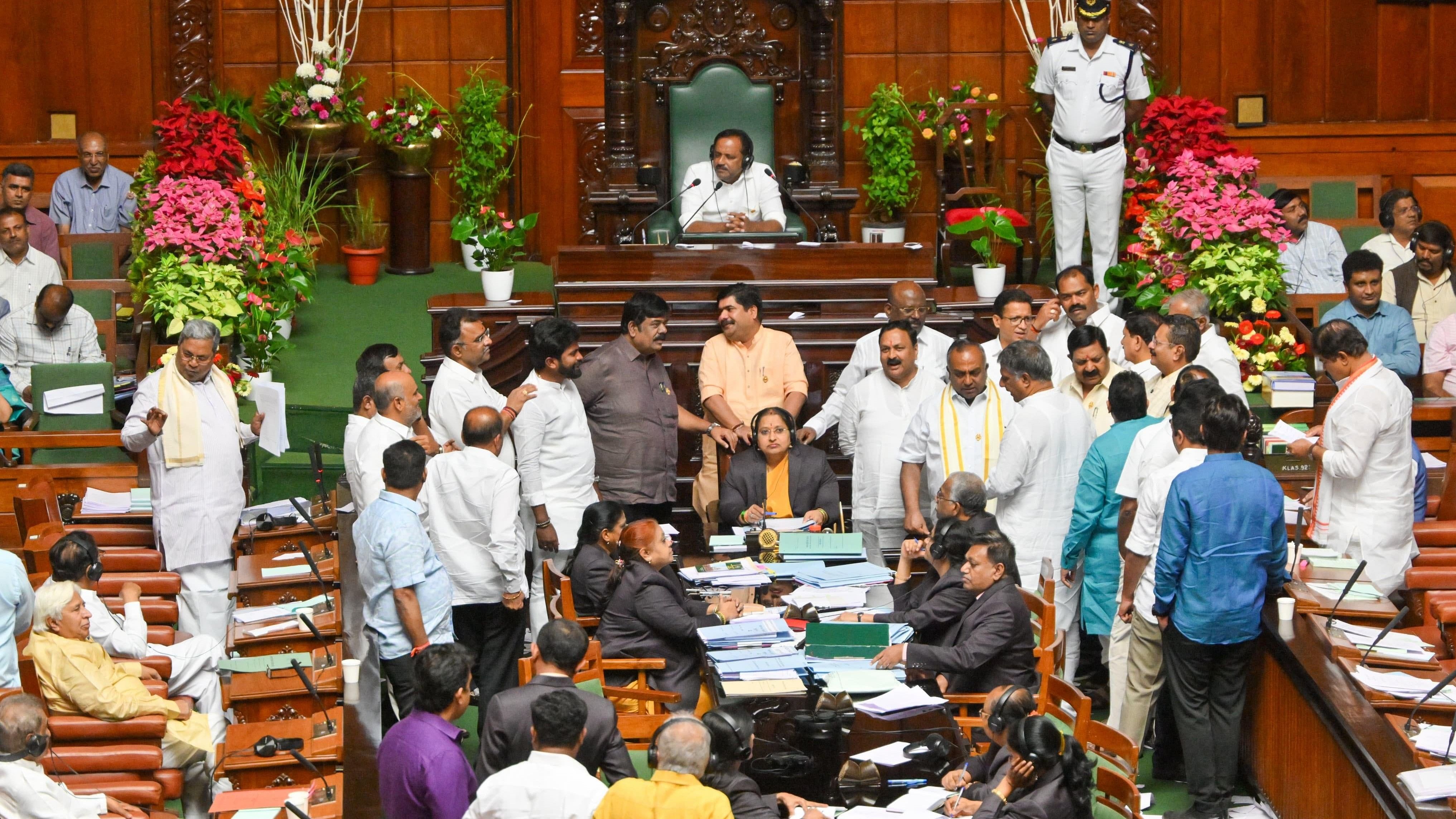 Opposition BJP members stage a protest in the Legislative Assembly on Thursday.