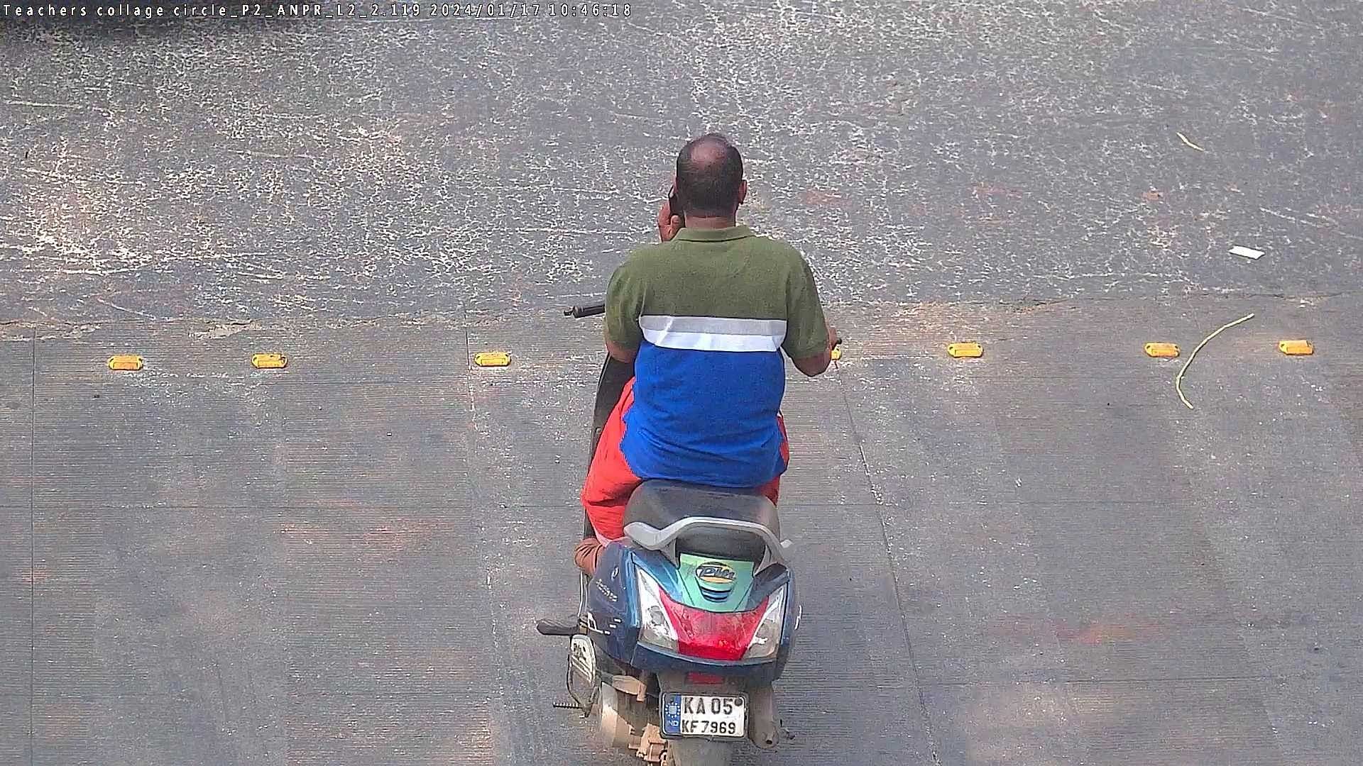 <div class="paragraphs"><p>In this photograph caught on a traffic camera, the&nbsp;motorist is seen riding without a helmet and speaking on the phone. </p></div>