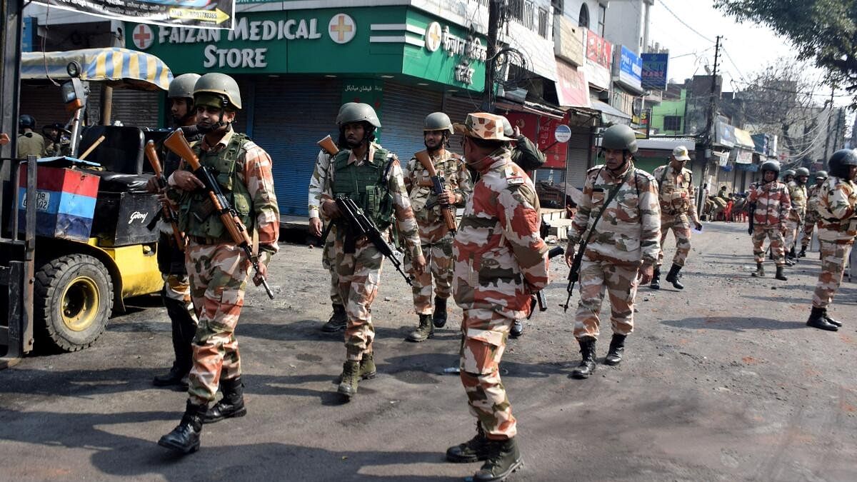 <div class="paragraphs"><p>Police officers patrol a road a day after clashes during a government demolition drive, in Haldwani, Uttarakhand</p></div>