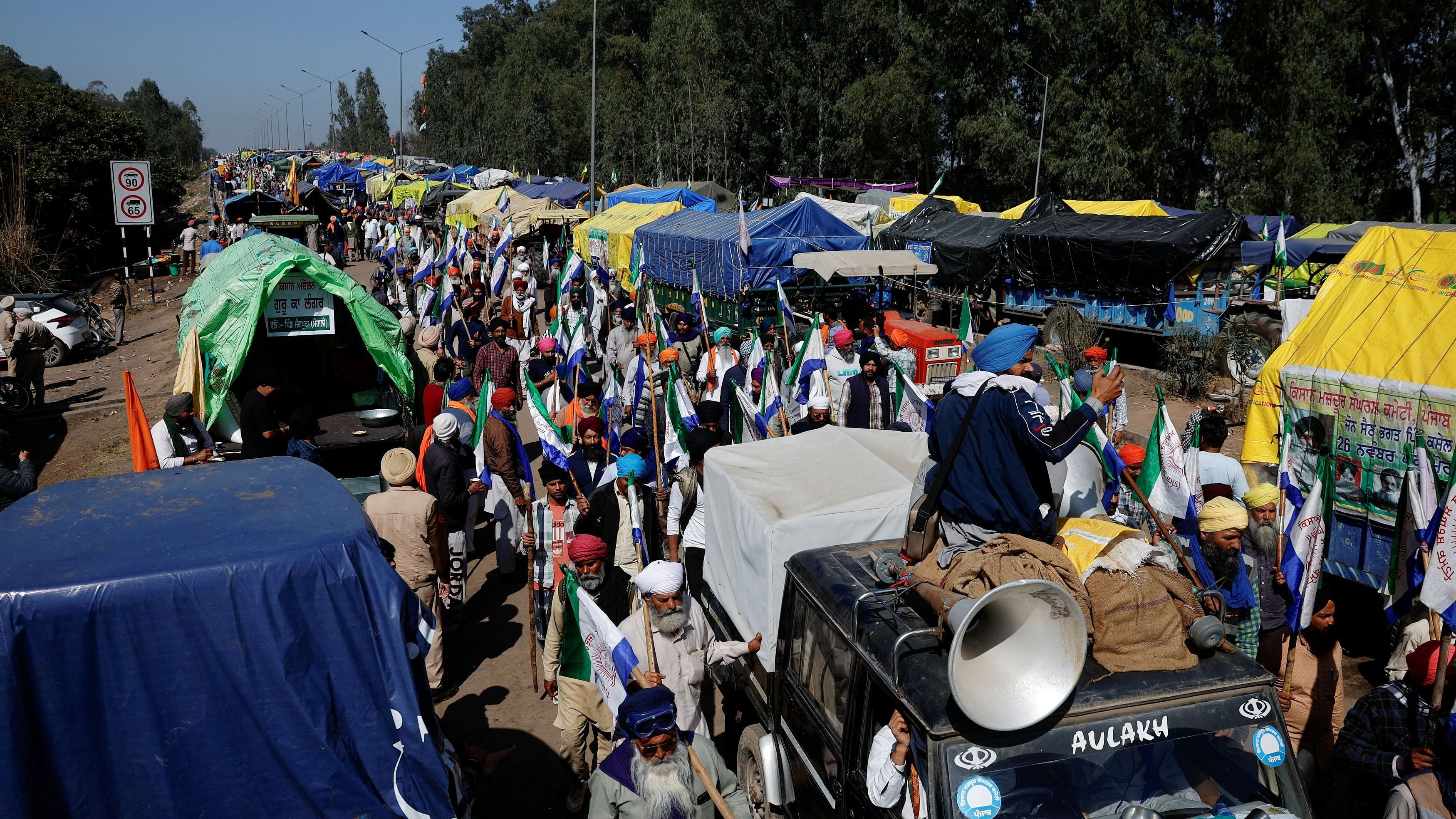 <div class="paragraphs"><p>Farmers take out a march to press for the better crop prices promised to them in 2021, at Shambhu barrier, a border between Punjab and Haryana, February 22, 2024. </p></div>