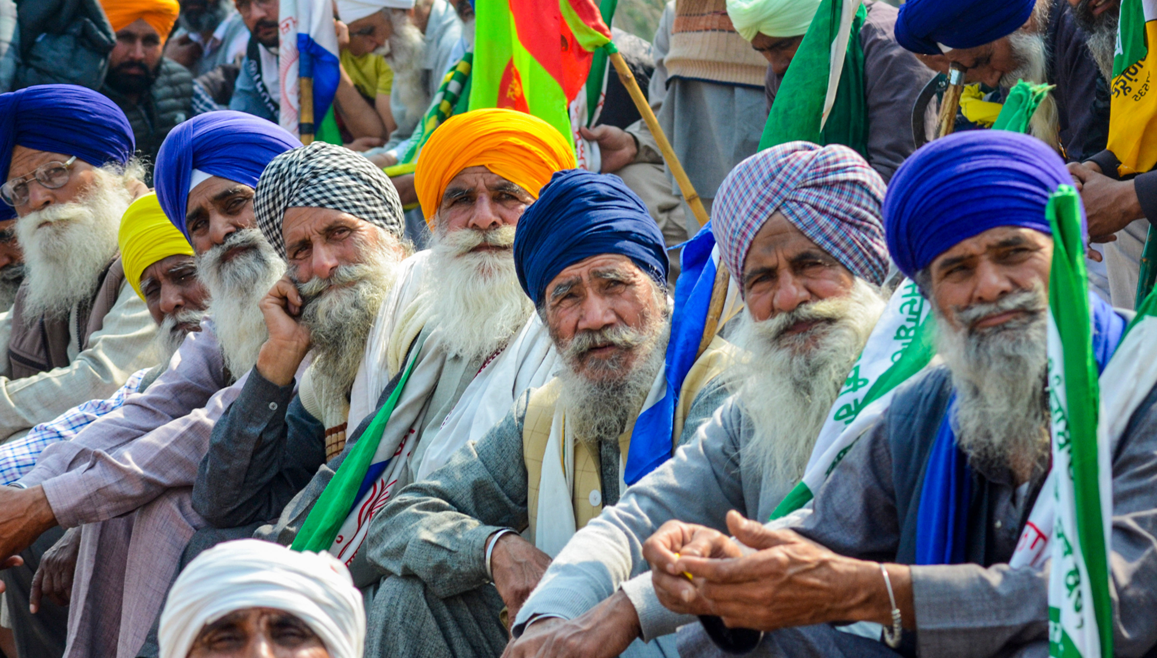 <div class="paragraphs"><p>Farmers listen to a leader (unseen) at the Punjab-Haryana Shambhu border during farmers' 'Delhi Chalo' protest, near Patiala district, Saturday, Feb. 17, 2024.</p></div>