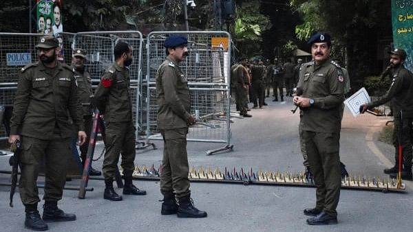 <div class="paragraphs"><p>Pakistan police personnel stand guard.</p></div>