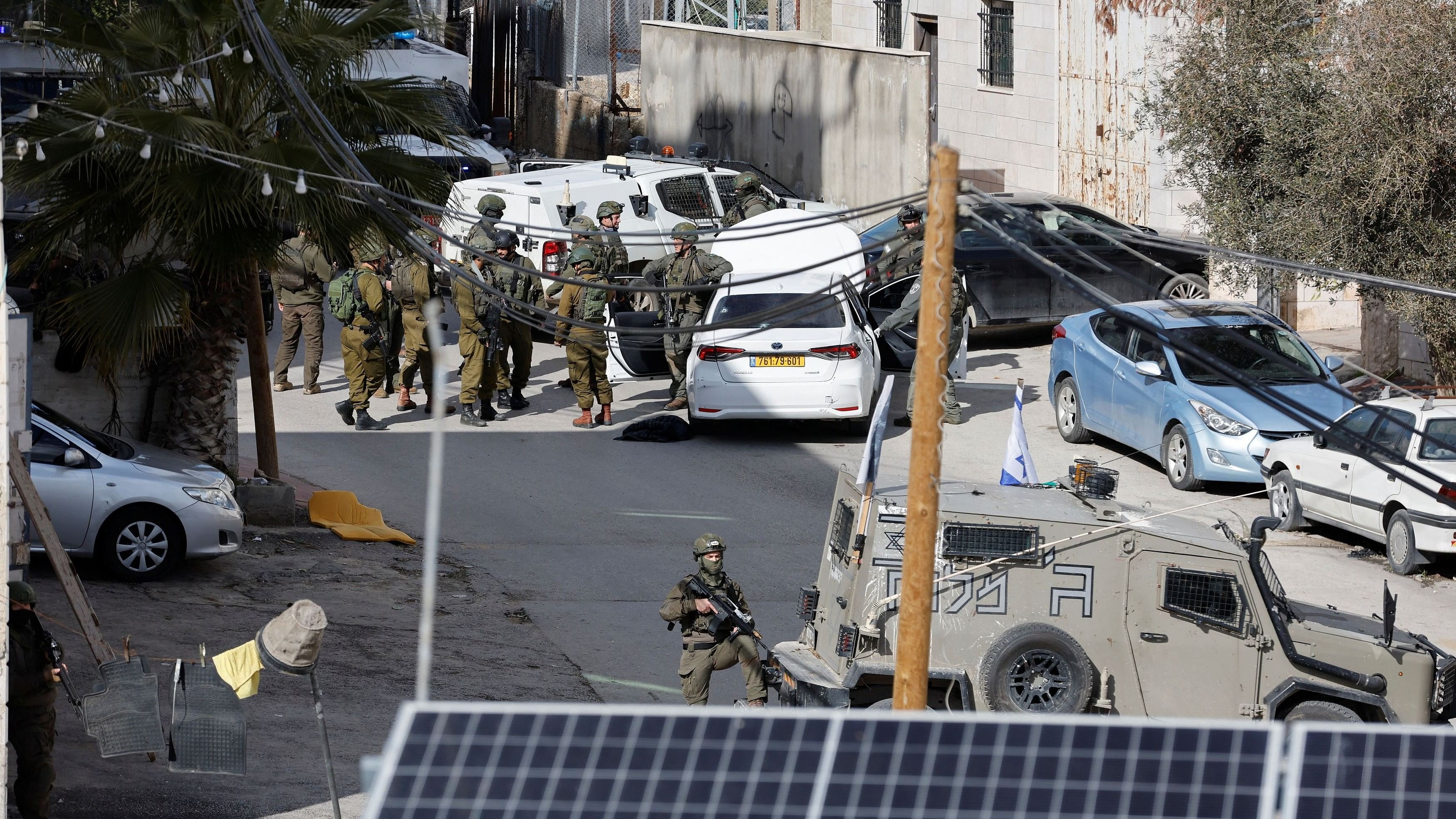 <div class="paragraphs"><p>Israeli troops stand guard near a shooting scene in Hebron in the Israeli-occupied West Bank.</p></div>