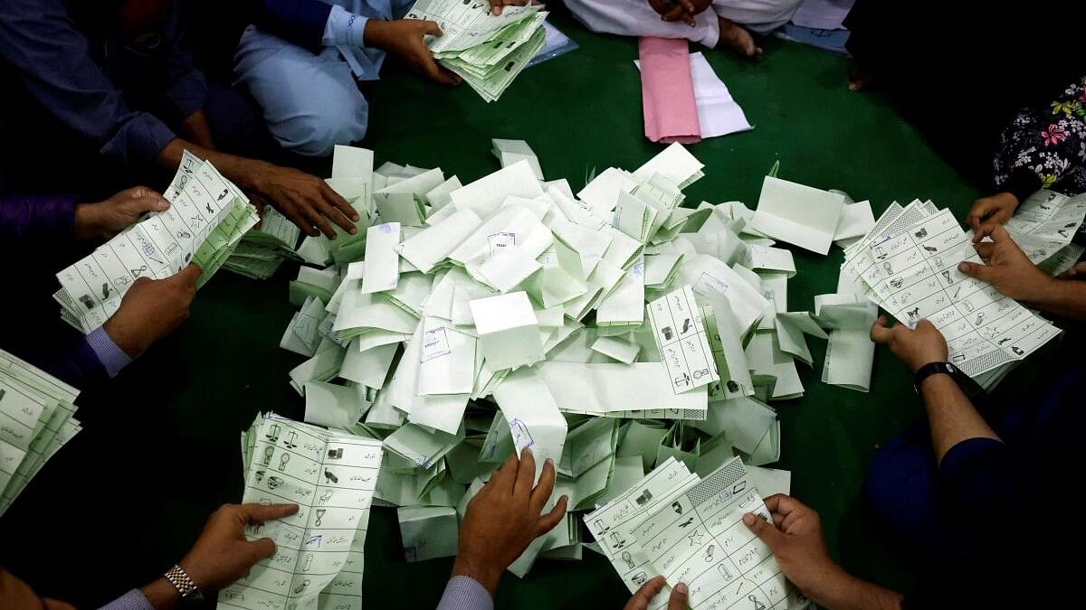 <div class="paragraphs"><p>Polling officers count ballot papers during the general election in Karachi, Pakistan February 8, 2024.</p></div>