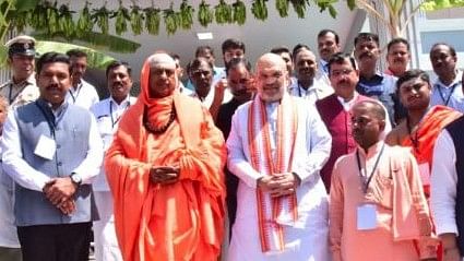 <div class="paragraphs"><p>Union Home Minister Amit Shah inaugurates&nbsp; Parvathamma Shamanuru Shivashankarappa Guest House, at Suttur, Mysuru district, on Sunday.</p></div>