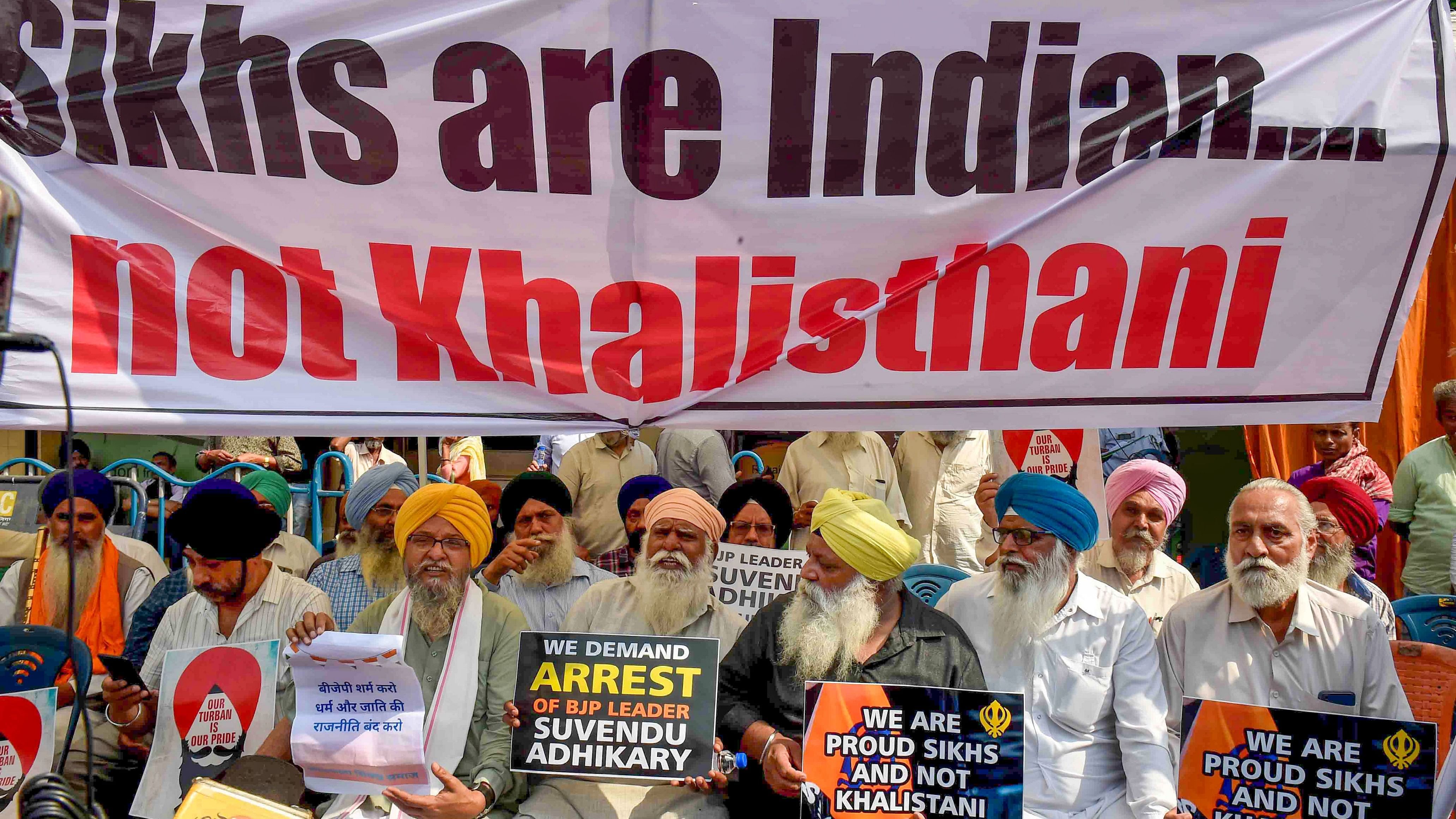 <div class="paragraphs"><p>People from the Sikh community stage a protest against BJP leader Suvendu Adhikari after he allegedly called a Sikh IPS officer 'Khalistani', outside BJP office, in Kolkata.</p></div>