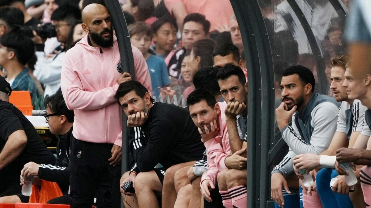 <div class="paragraphs"><p>Inter Miami's Lionel Messi, Sergio Busquets and teammates sit on the substitute bench during the Inter Miami vs Hong Kong match</p></div>