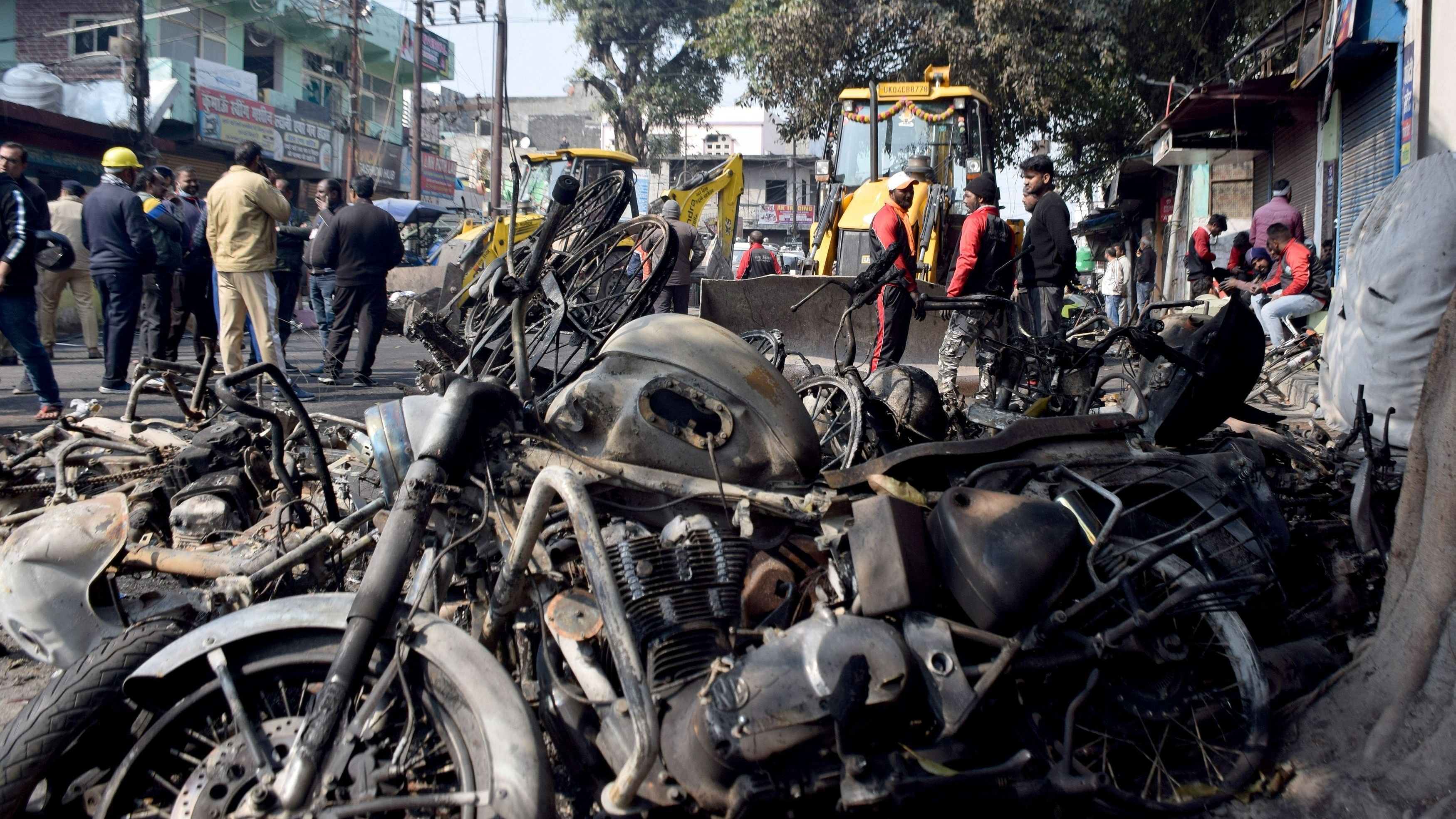 <div class="paragraphs"><p>Burnt motorbikes lie on a road a day after clashes during a government demolition drive, in Haldwani in Uttarakhand. February 9, 2024. </p></div>