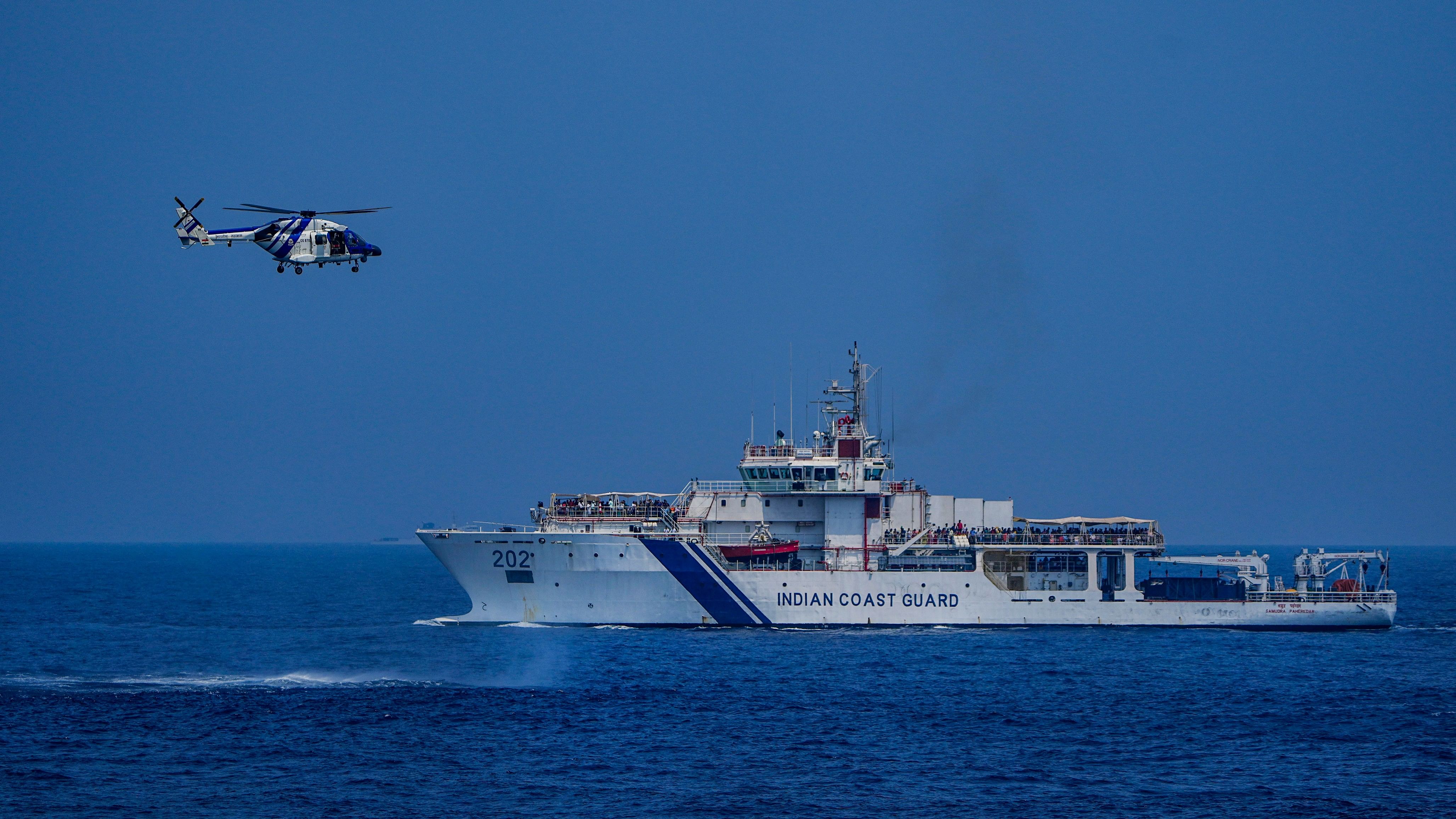 <div class="paragraphs"><p>Indian Coast Guard (ICG) ship and helicopter during the 'Day at Sea' event organised as part of the 48th Raising Day of ICG in the Bay of Bengal, off Chennai harbour, Sunday, Feb. 25, 2024.</p></div>