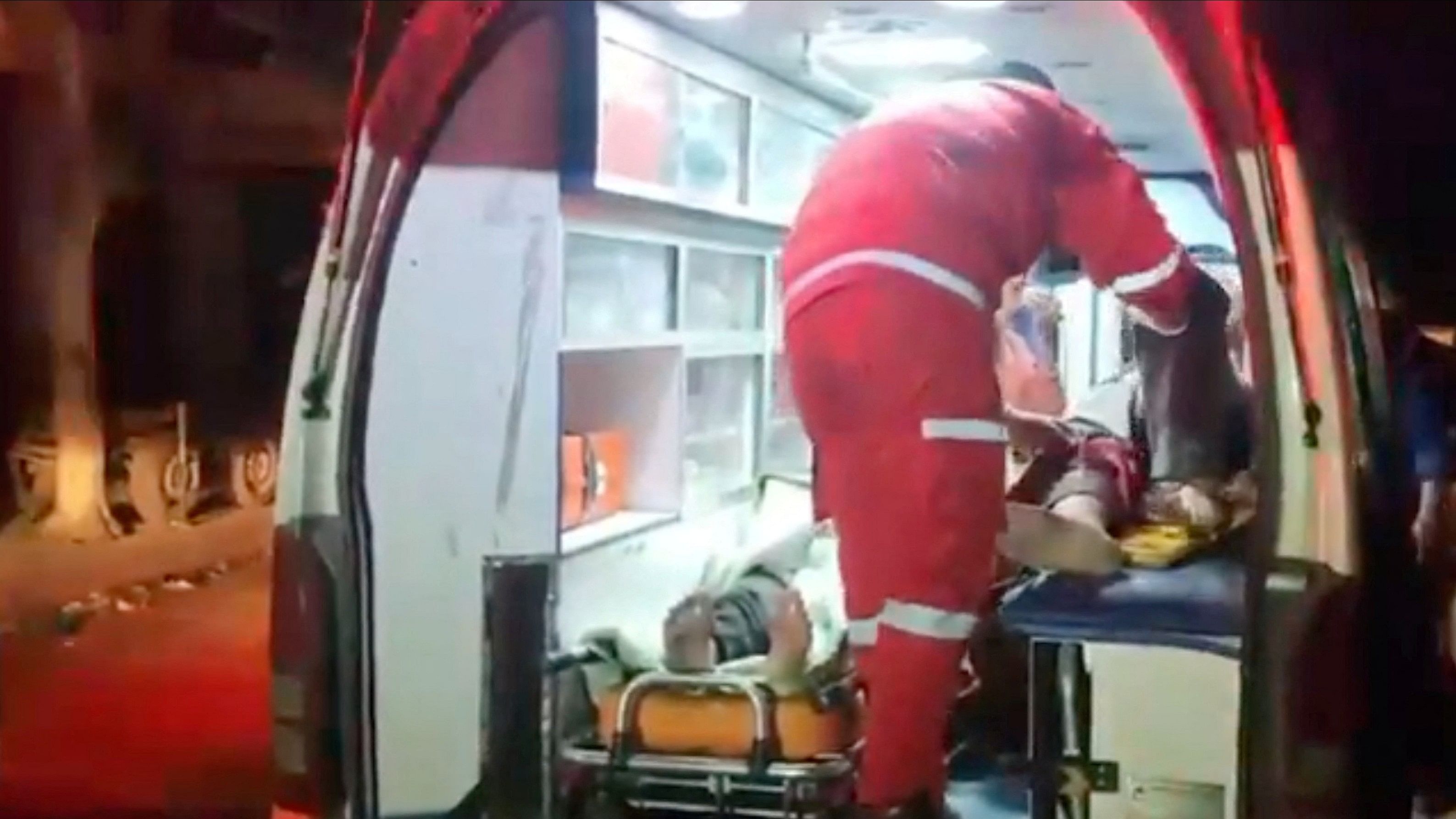 <div class="paragraphs"><p>People inside a Palestine Red Crescent ambulance in Deir al-Balah, Gaza, in this screen grab obtained from a social media video released on February 8, 2024. </p></div>