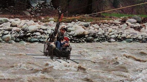 <div class="paragraphs"><p>A file photo of an army person rescues a person from flash floods in Jammu and Kashmir </p></div>