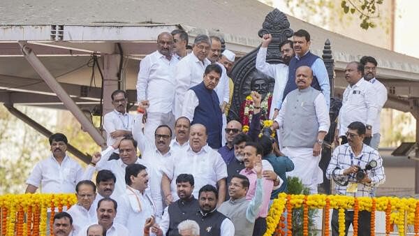 <div class="paragraphs"><p>Maharashtra Chief Minister Eknath Shinde with Deputy Chief Ministers Devendra Fadnavis and Ajit Pawar and others pays tribute to the staute of Chhatrapati Shivaji Maharaj during a special session of the state Assembly on Maratha quota, in Mumbai, Tuesday, Feb 20.</p></div>