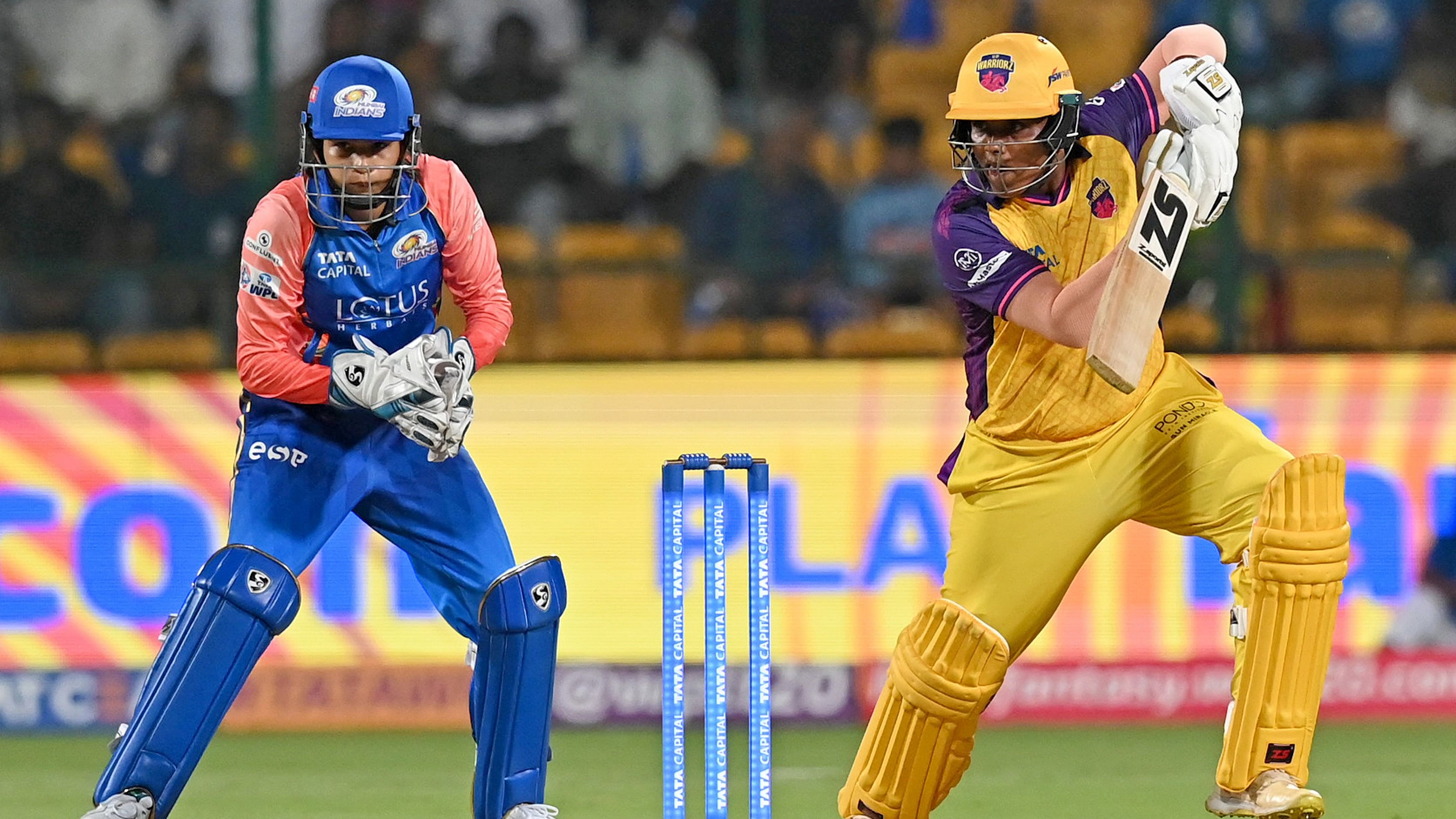 <div class="paragraphs"><p>UP Warriorz’s Kiran Navgire (right) punches one en-route her quick-fire 57 against Mumbai Indians in the WPL at the M Chinnaswamy Stadium in Bengaluru on Wednesday.</p></div>