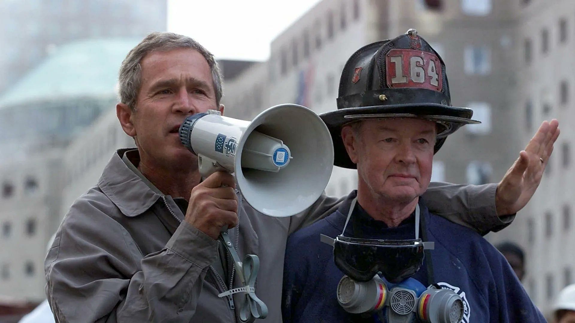 <div class="paragraphs"><p>File photo of former US President George W. Bush with&nbsp;Bob Beckwith, a retired firefighter from Long Island who aided in the search for survivors after the terrorist attacks of September 11, 2001.</p></div>