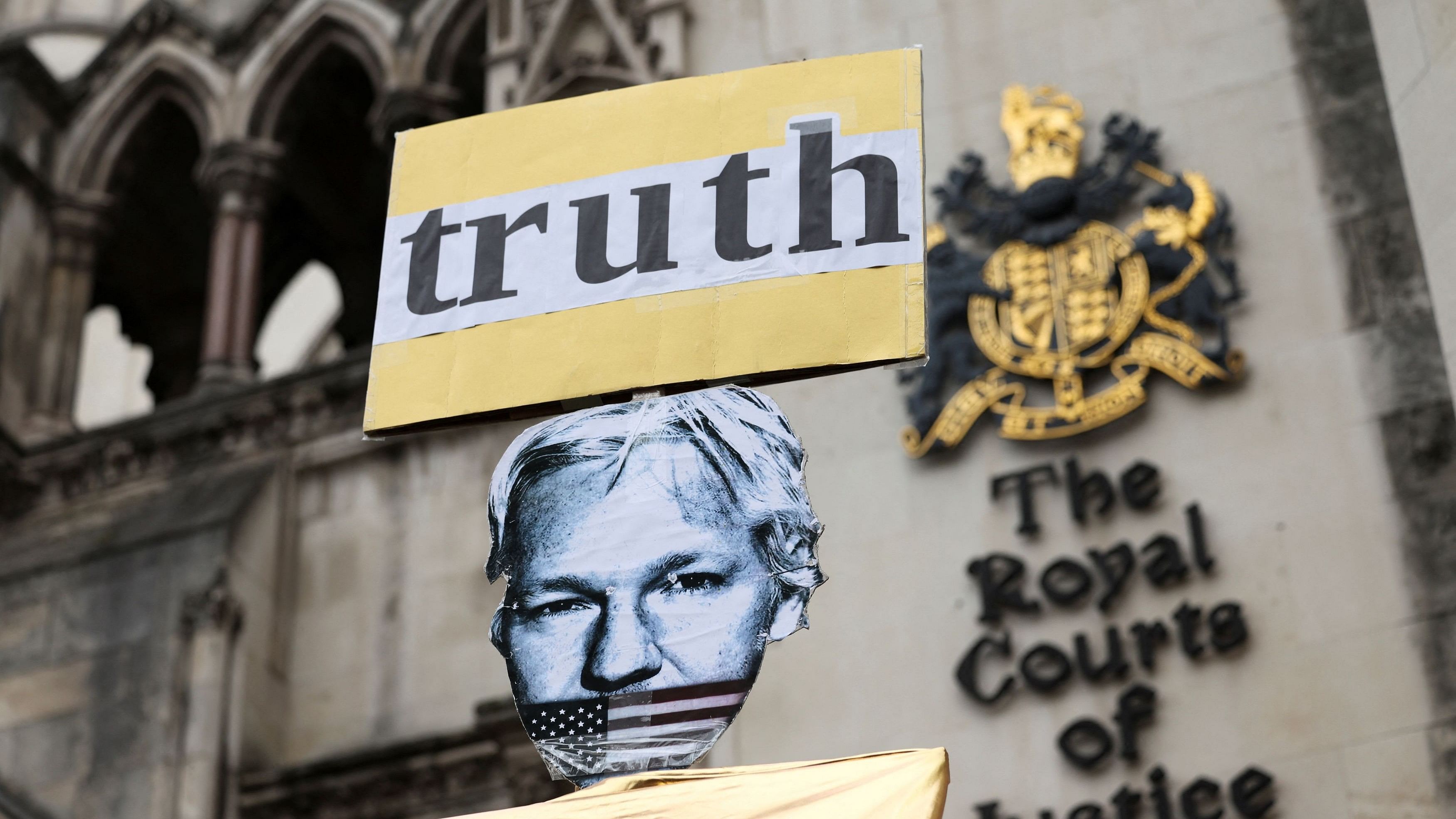 <div class="paragraphs"><p>A view of a placard depicting WikiLeaks founder Julian Assange outside the high court on the day Assange appeals against his extradition to the United States, in London, Britain, February 20, 2024.</p></div>