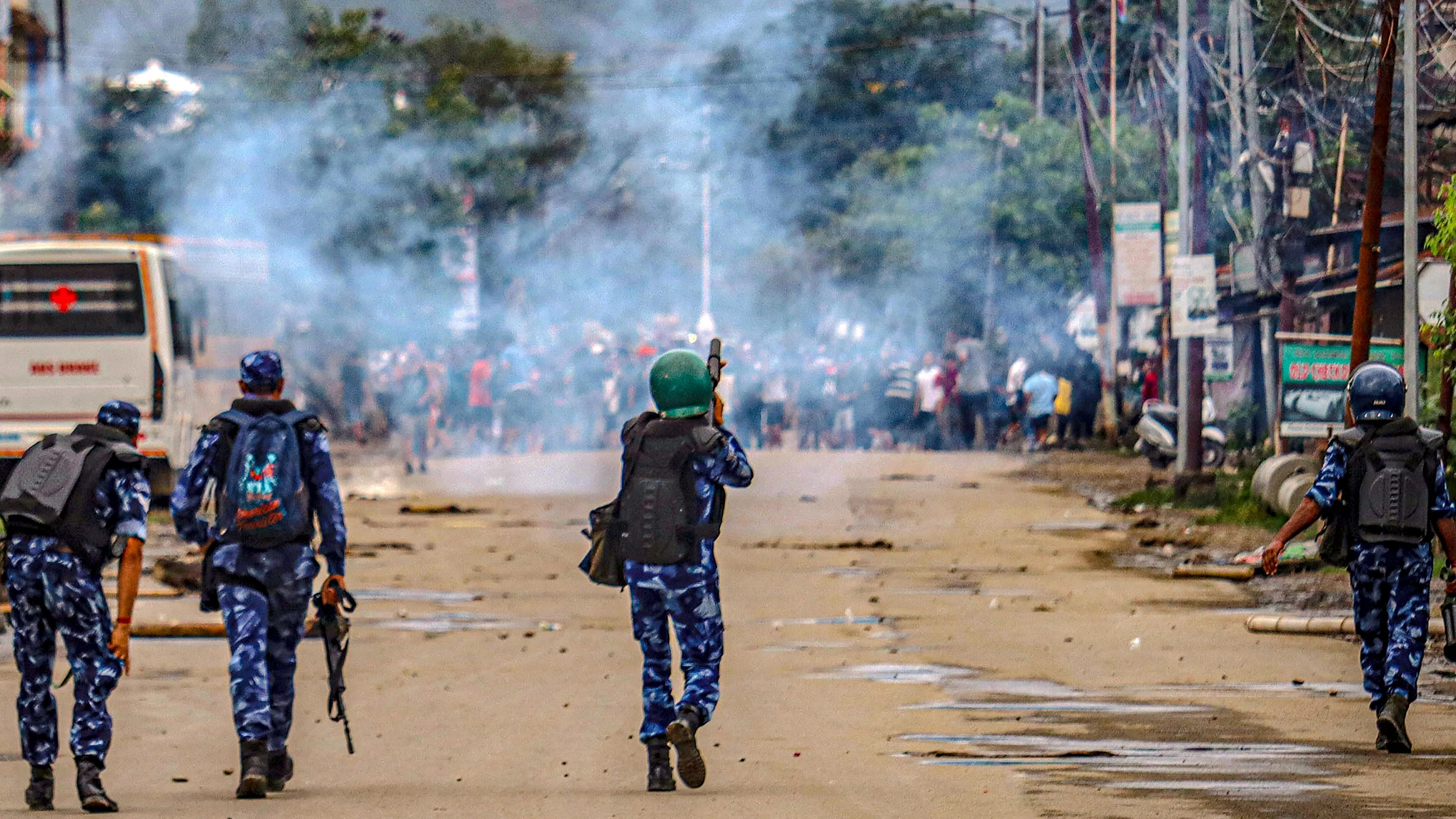 <div class="paragraphs"><p>Imphal: Security personnel fire tear gas shells as students protest against the "killing" of two missing students</p></div>