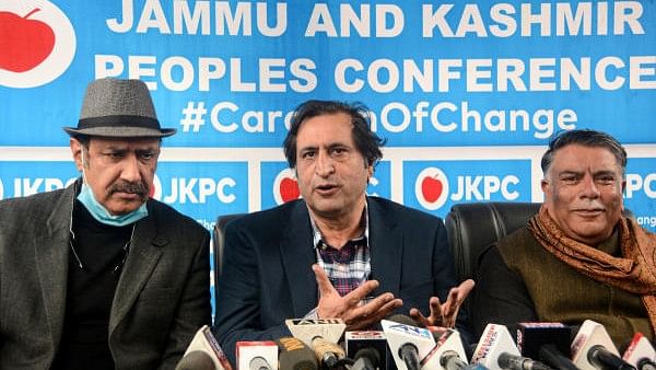 <div class="paragraphs"><p>Jammu and Kashmir Peoples Conference  President Sajjad Gani Lone (centre).</p></div>