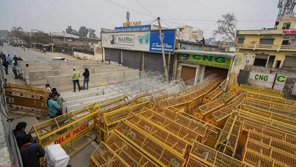 <div class="paragraphs"><p>Road blocks being placed at Singhu Border ahead of the scheduled 'Delhi Chalo' march by the protesting farmers, in New Delhi, Monday, Feb. 12, 2024.</p></div>