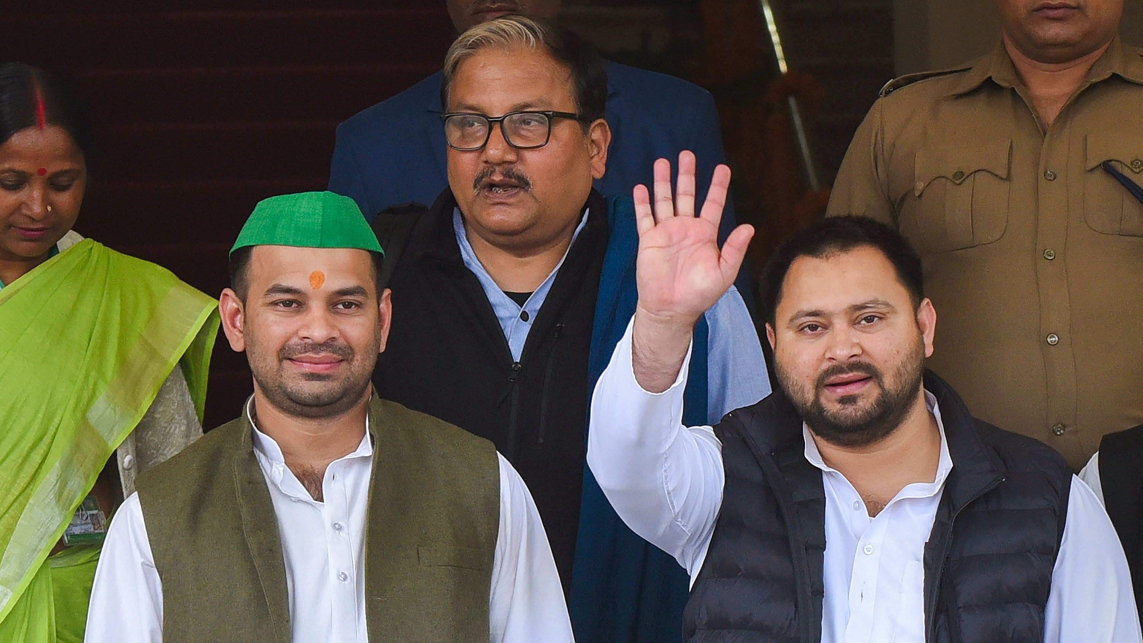 <div class="paragraphs"><p>RJD leader Tejashwi Yadav with party MLA Tej Pratap Yadav and MP Manoj Kumar Jha </p></div>