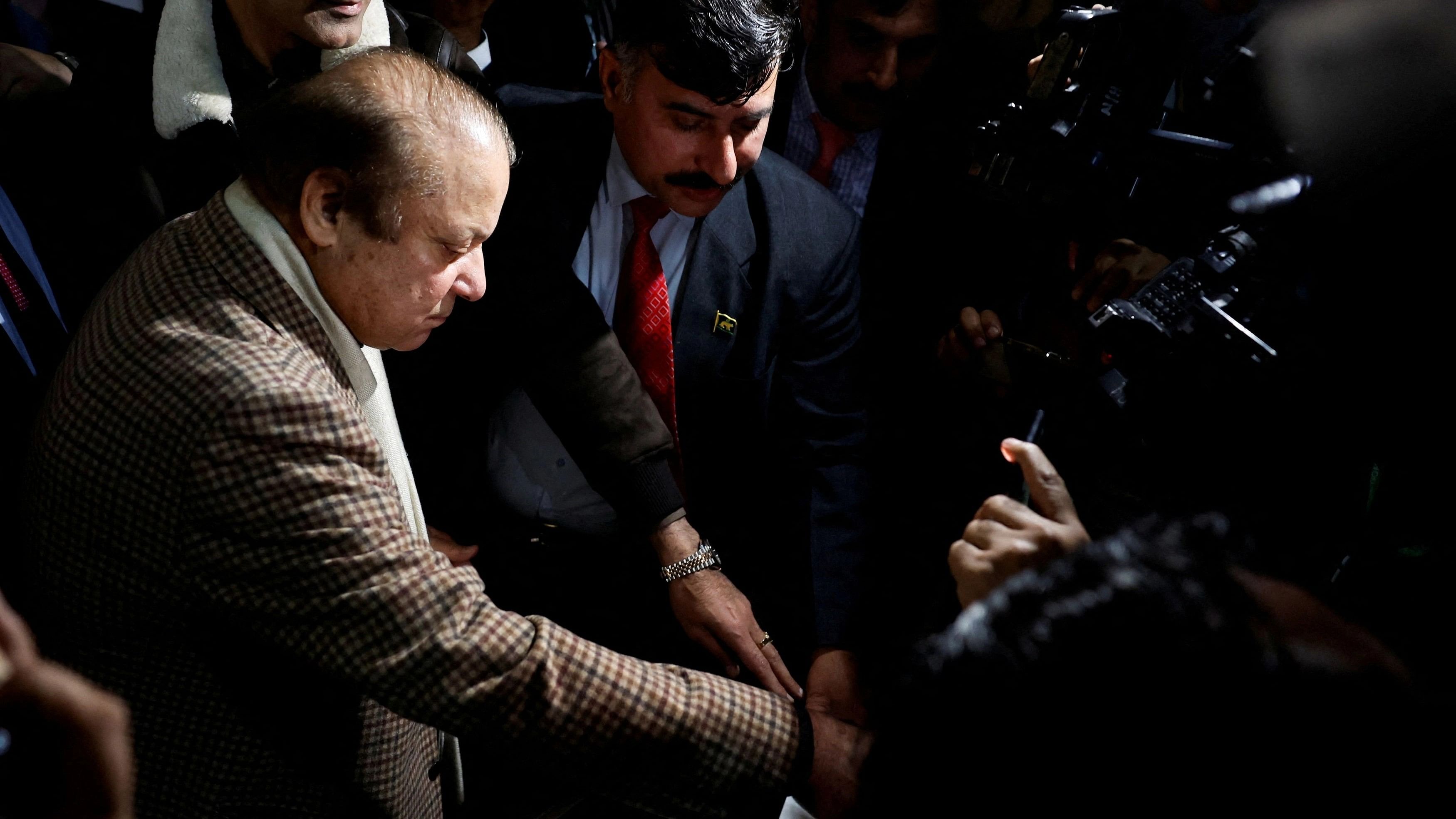 <div class="paragraphs"><p>Former Prime Minister Nawaz Sharif casts his vote at a polling station during the general election, in Lahore, Pakistan, February 8, 2024.</p></div>