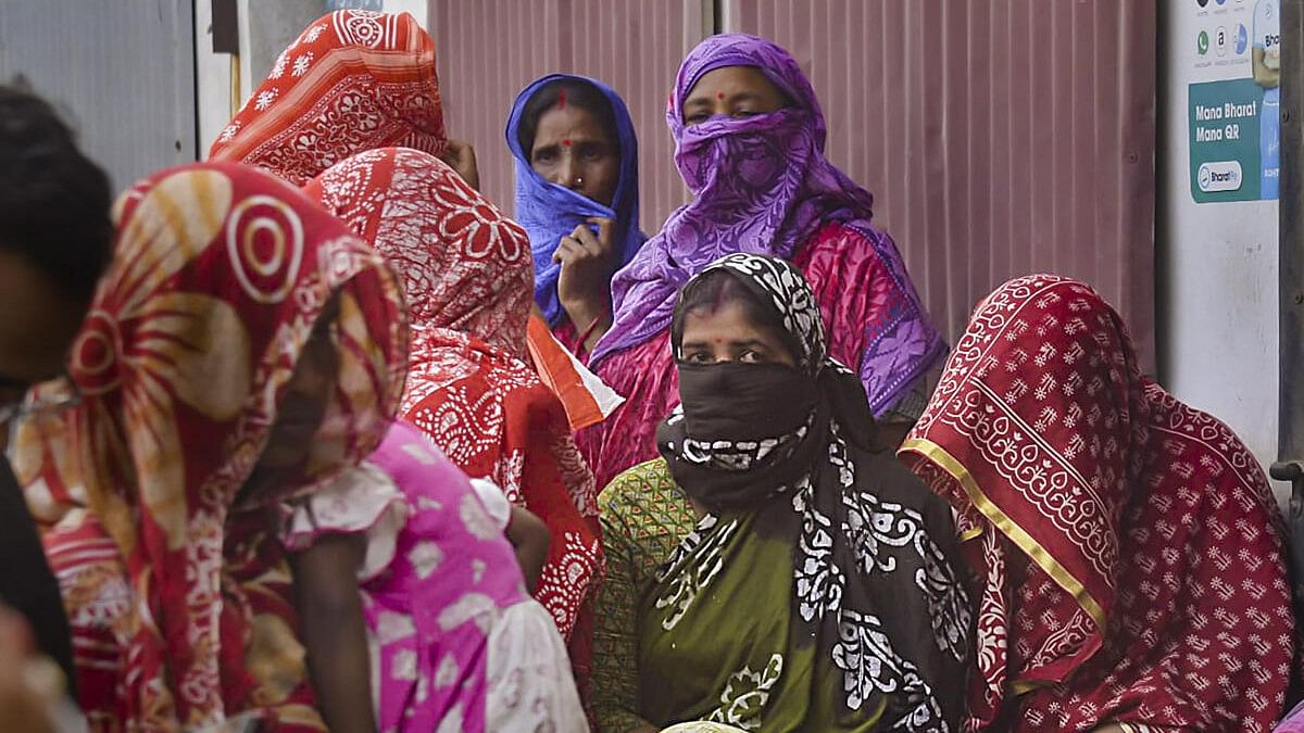 <div class="paragraphs"><p>File photo of local women waiting to meet NCW Chairperson Rekha Sharma( not seen in photo) during her visit to Sandeshkhali earlier this week.&nbsp;</p></div>