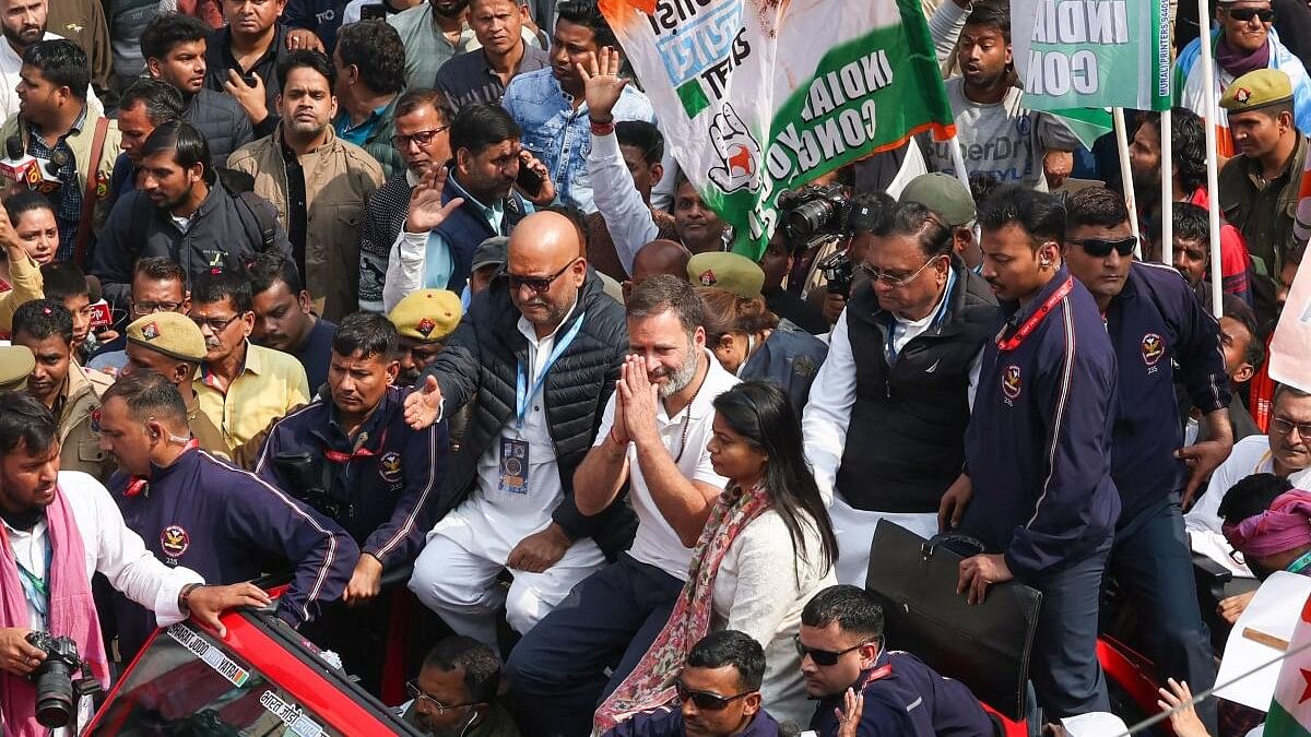 <div class="paragraphs"><p>Rahul Gandhi&nbsp;gestures to the public from atop a vehicle during the 'Bharat Jodo Yatra' roadshow in Uttar Pradesh.&nbsp;</p></div>