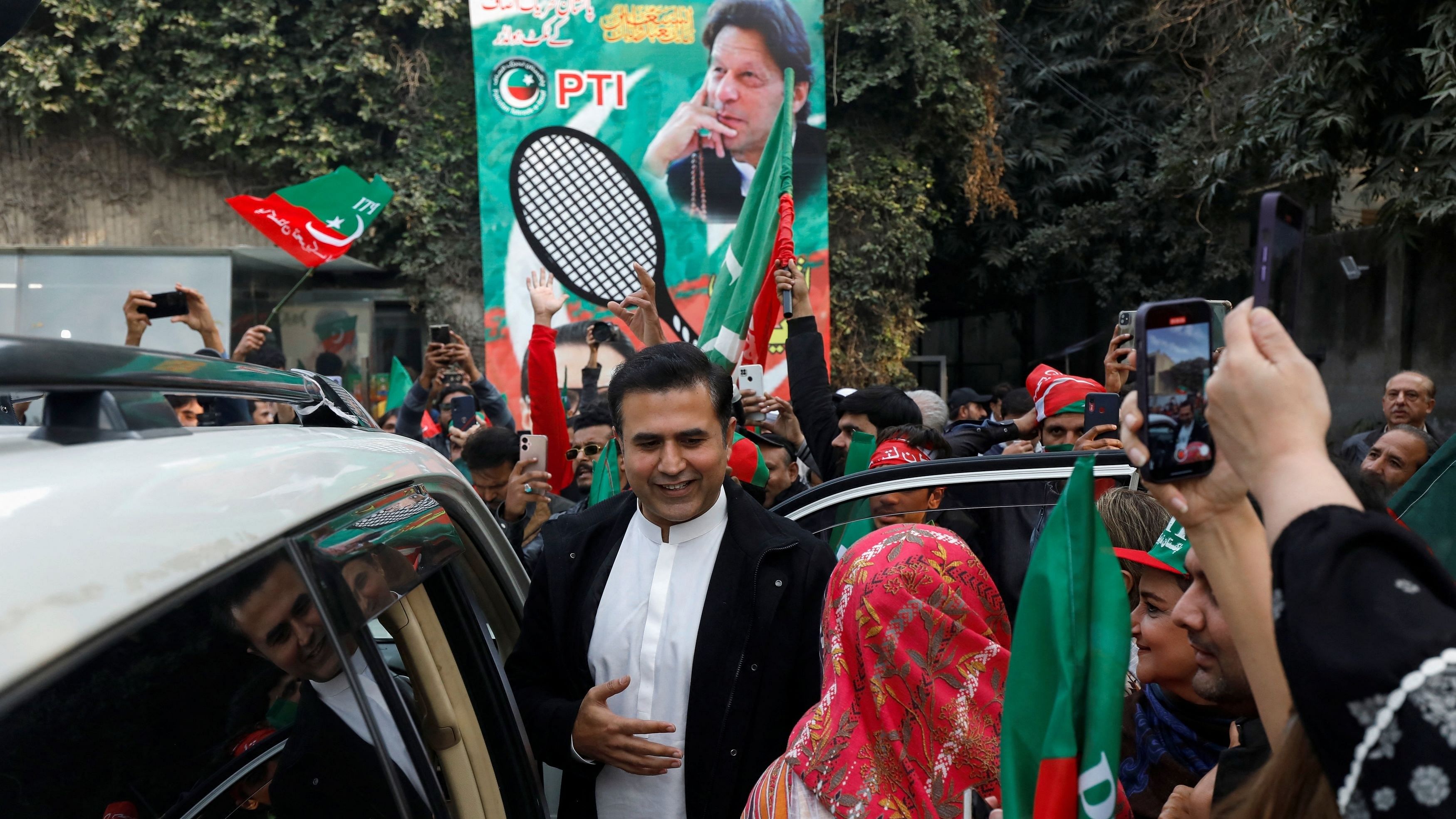 <div class="paragraphs"><p>Supporters and party workers of former Prime Minister Imran Khan gather during a rally ahead of the general elections in Lahore.</p></div>