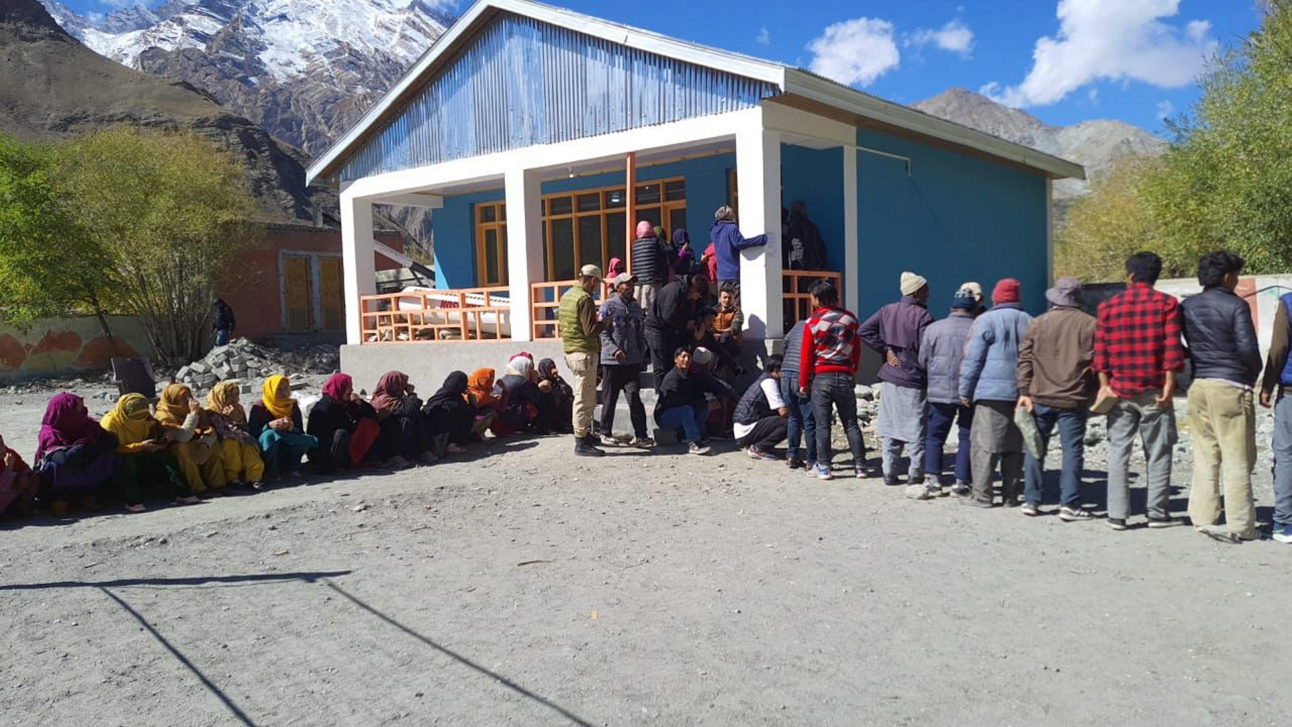 <div class="paragraphs"><p>File photo of voters waiting to cast their votes for the 5th LAHDC Kargil elections, in Kargil, in 2023.</p></div>