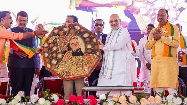 <div class="paragraphs"><p>Union Home Minister Amit Shah being felicitated during the 'Yuva Sammelan', in Jalgaon, Tuesday, March 5, 2024. Maharashtra Deputy Chief Minister Devendra Fadnavis is also seen.</p></div>