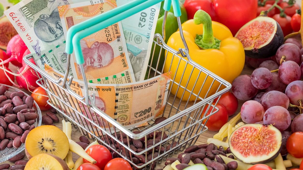 <div class="paragraphs"><p>Representative image showing a food basket and Indian rupee notes.</p></div>
