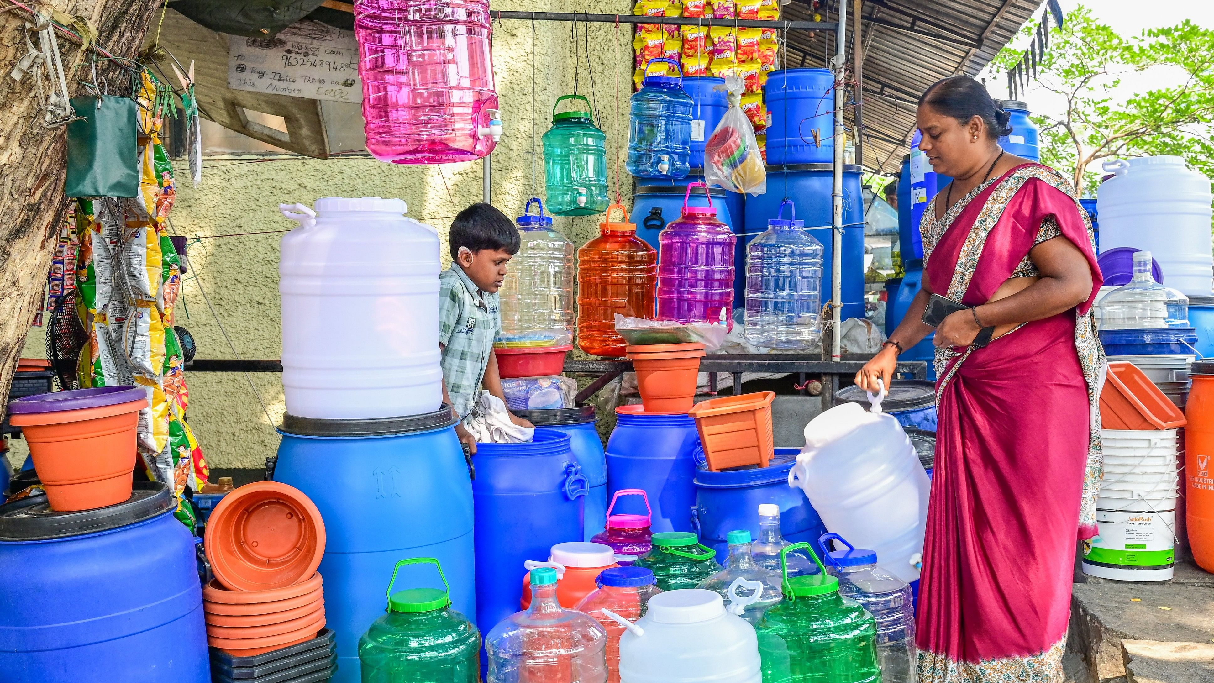 <div class="paragraphs"><p>A woman buys a water can in Rajajinagar on Wednesday. Concerns over drinking water scarcity have surfaced across Bengaluru. </p></div>