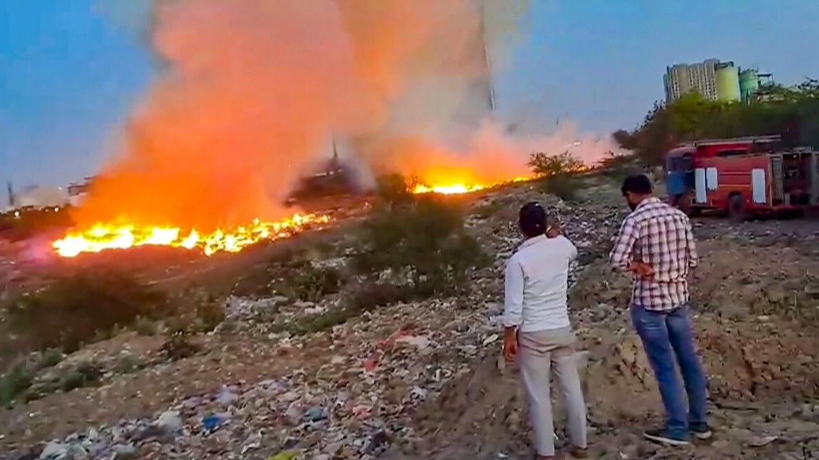 <div class="paragraphs"><p>Flames and smoke rising out after the fire broke out at the dumping yard in Noida.</p></div>