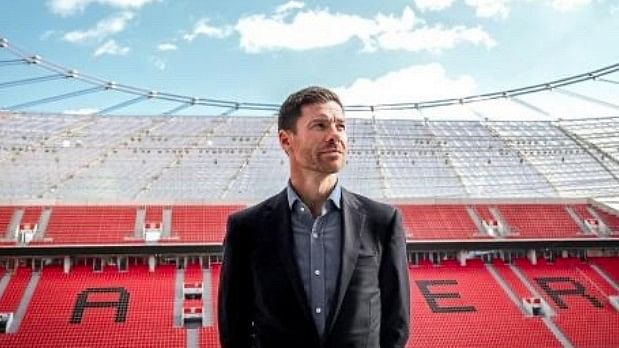 <div class="paragraphs"><p>Xabi Alonso with the Leverkausen stadium in the backdrop.</p></div>