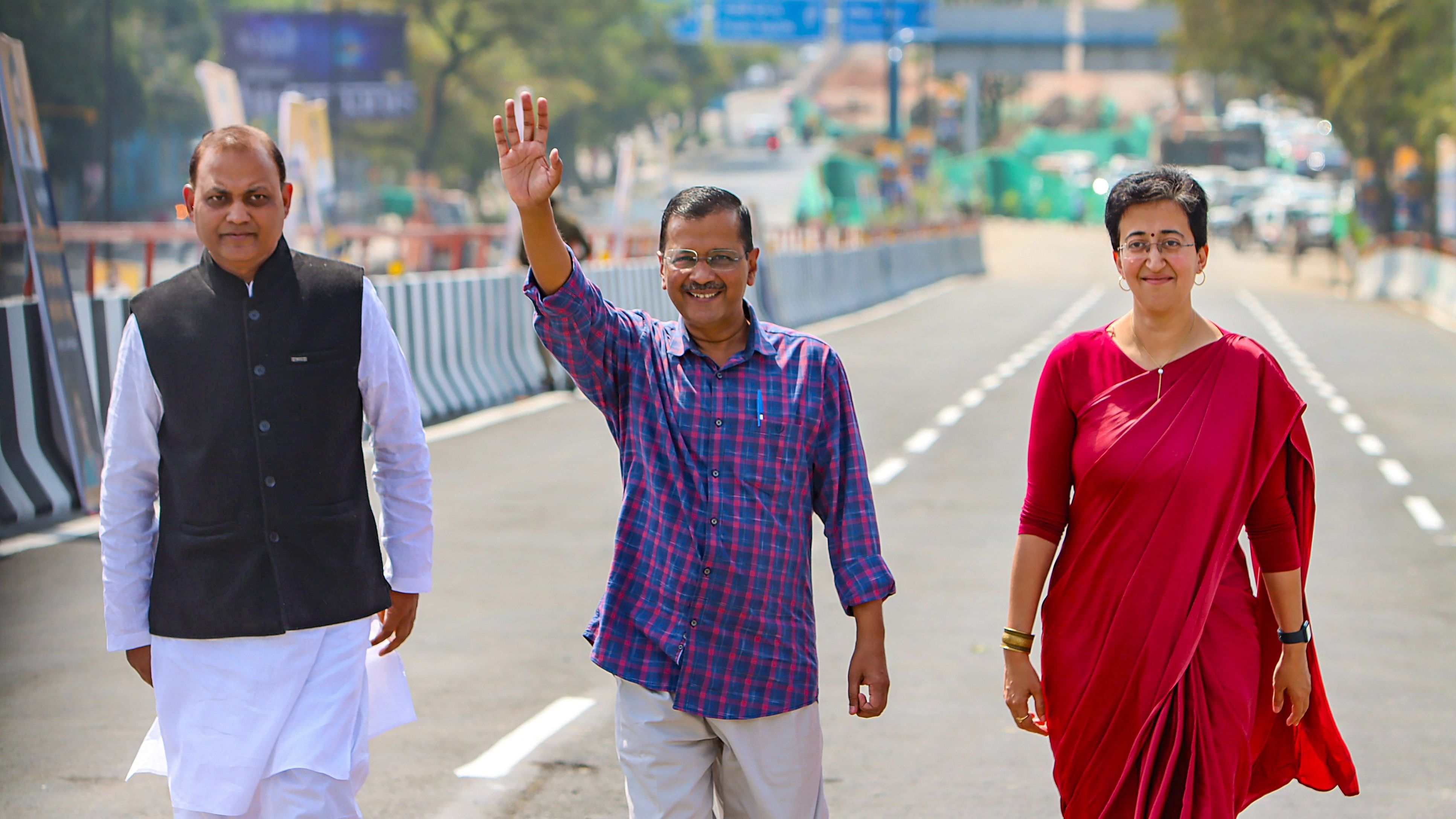 <div class="paragraphs"><p>Delhi Chief Minister Arvind Kejriwal with state Cabinet Minister Atishi and AAP MLA Somnath Bharti during the inauguration of a three-lane flyover at Moti Nagar, in New Delhi, Wednesday, March 13, 2024.</p></div>