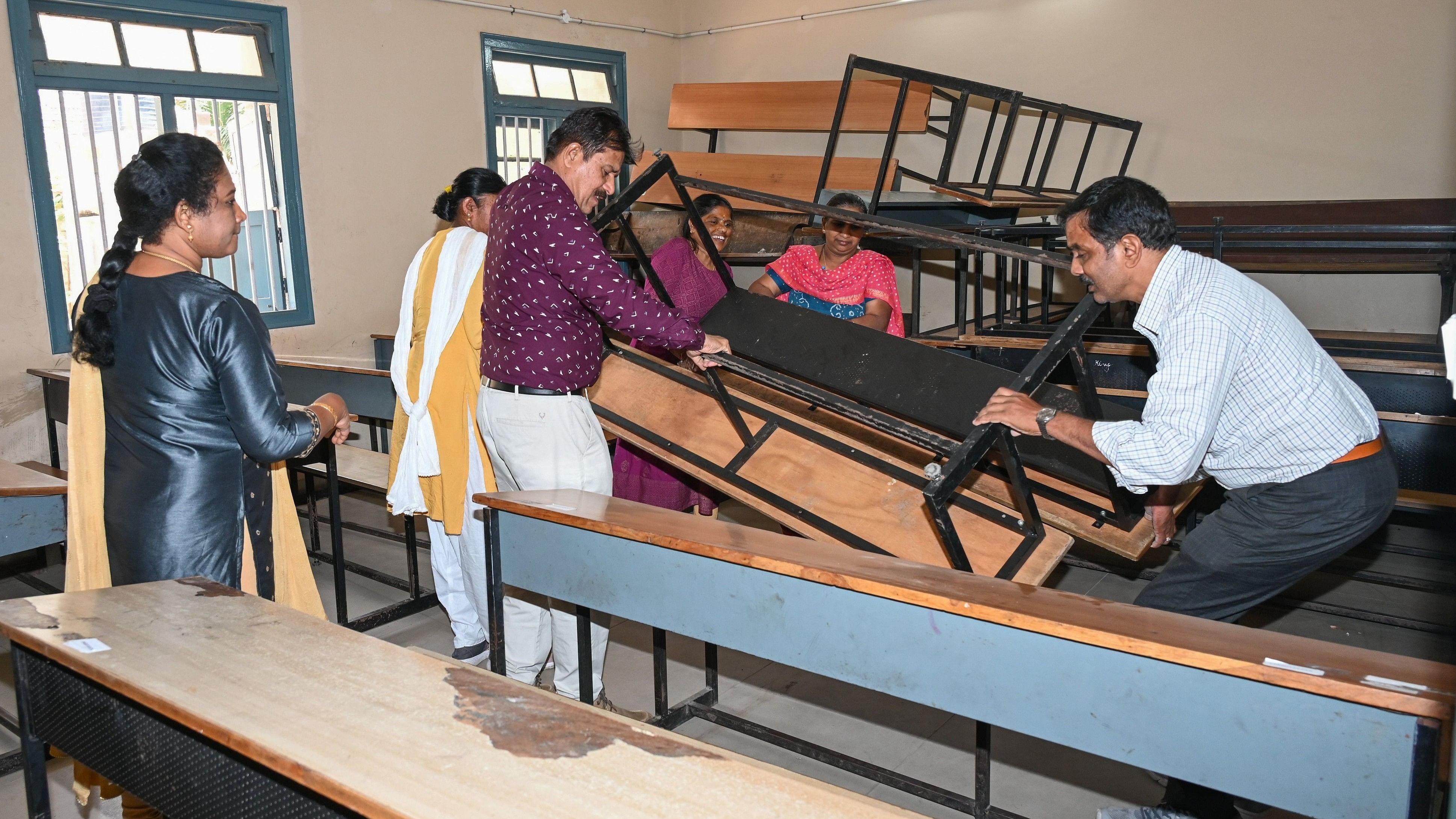 <div class="paragraphs"><p>Teachers and staff preparing class room for SSLC Examination by Karnataka School Examination and Assessment (KSEA) Board at Karnataka Public School, 13th Cross Malleshwara in Bengaluru on Saturday, 23rd March 2024. </p></div>