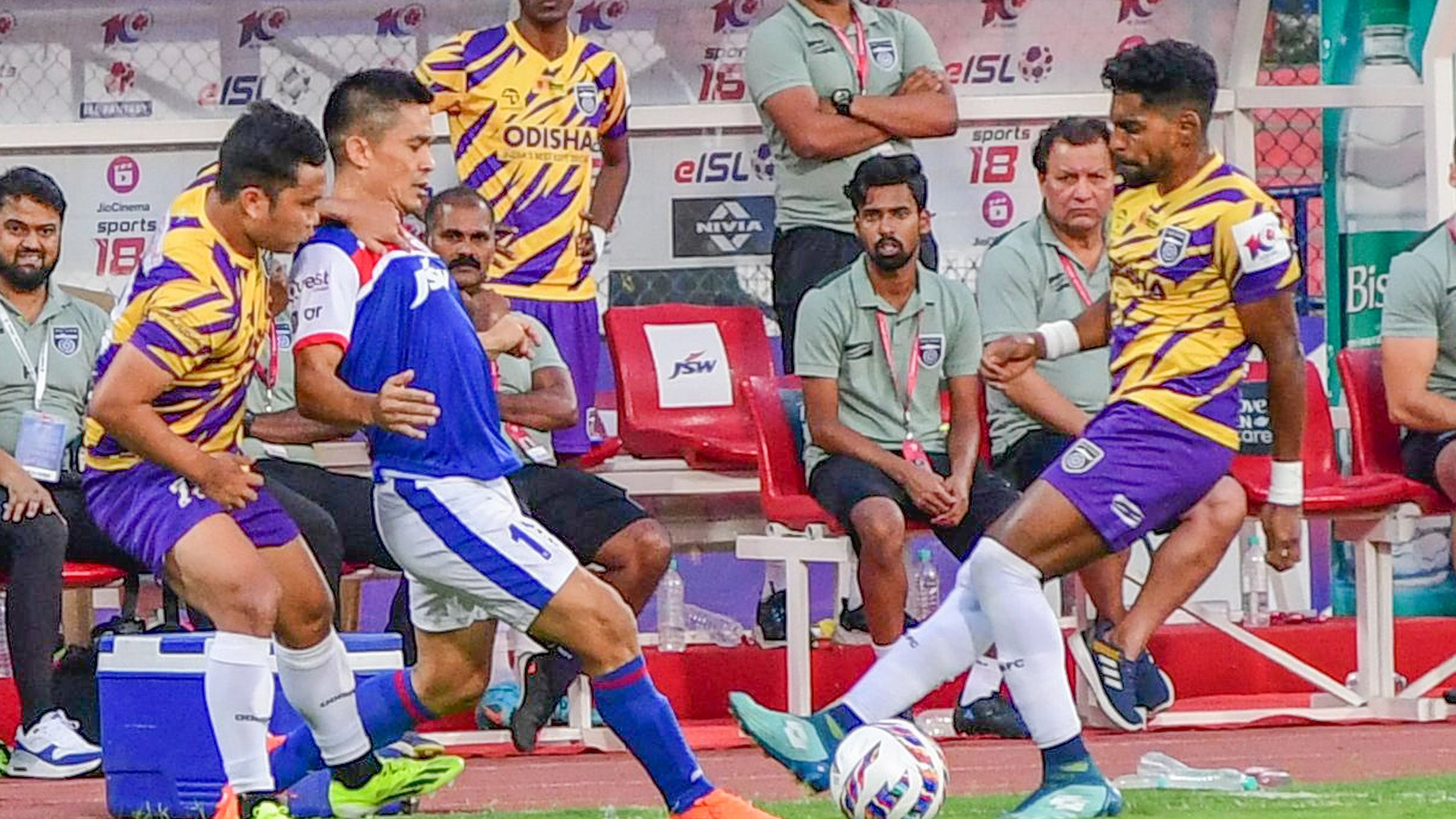 <div class="paragraphs"><p>Sunil Chhetri (second from left) of Bengaluru FC vies for possession with Jerry Lalrinzuala Derry (left) and Roy Krishana of Odisha FC during their ISL clash. </p></div>