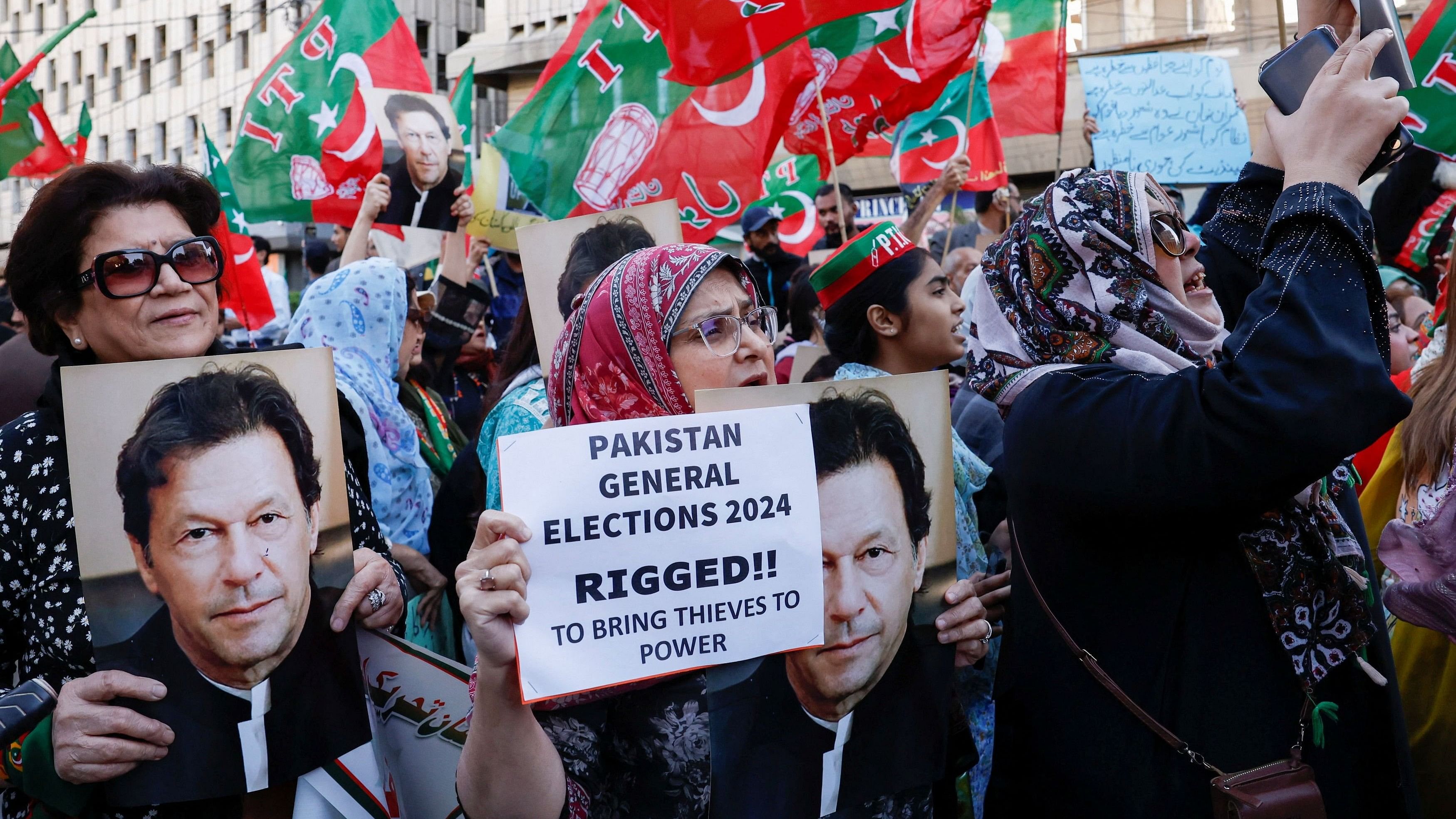 <div class="paragraphs"><p>Supporters of former Prime Minister Imran Khan's party, carry posters and placards as they chant slogans against what they call, 'blatant rigging in national election', during a protest in Pakistan.</p></div>