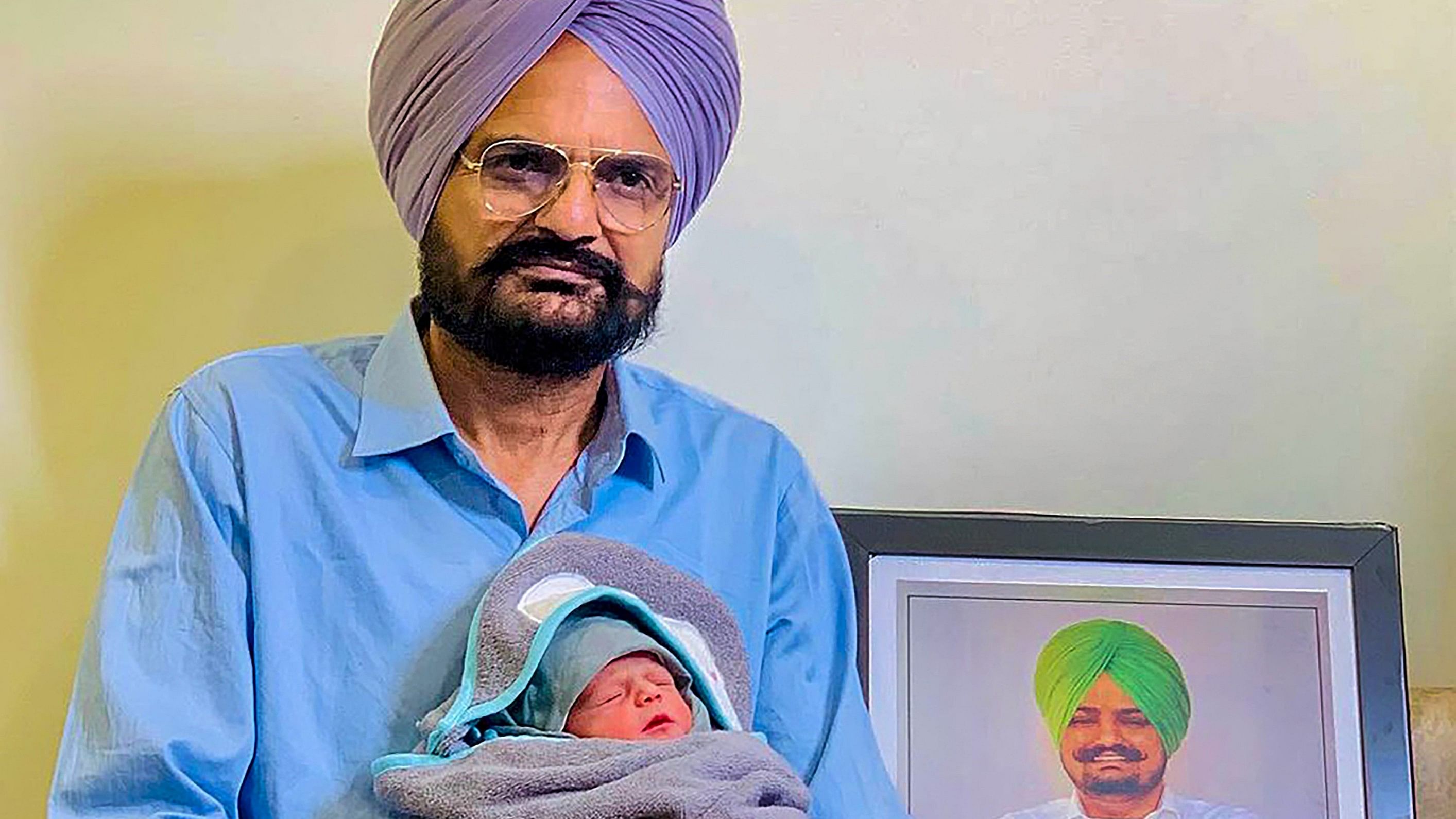 <div class="paragraphs"><p>Balkaur Singh, father of Punjabi singer Sidhu Moosewala, with his newborn baby.</p></div>