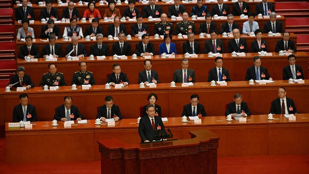<div class="paragraphs"><p>Chinese Premier Li Qiang delivers the work report at the opening session of the National People's Congress (NPC) at the Great Hall of the People in Beijing, China.</p></div>