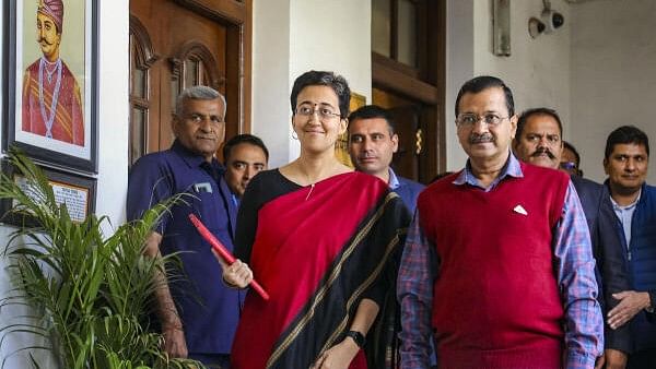 <div class="paragraphs"><p>Delhi Finance Minister Atishi Singh with Chief Minister Arvind Kejriwal arrives at the Vidhan Sabha to present the State Budget 2024-25, in Delhi, Monday, March 4, 2024.</p></div>