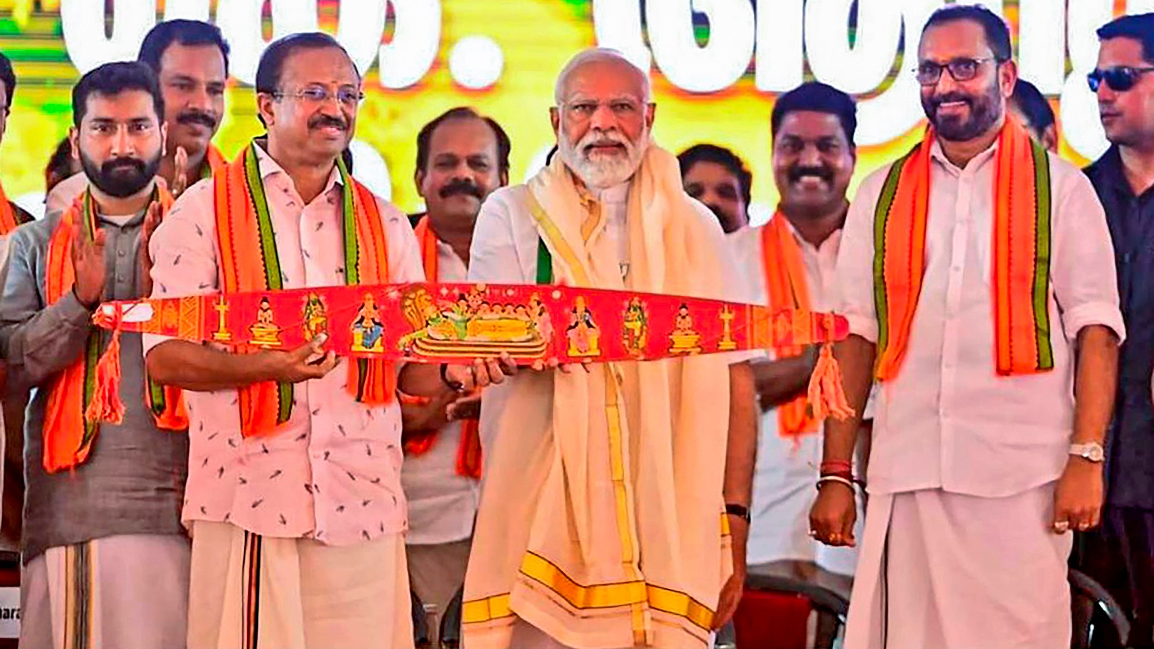 <div class="paragraphs"><p>File photo of&nbsp;Prime Minister Narendra Modi being presented the traditional Onavillu  during a public meeting in Kerala's Pathanamthitta.</p></div>