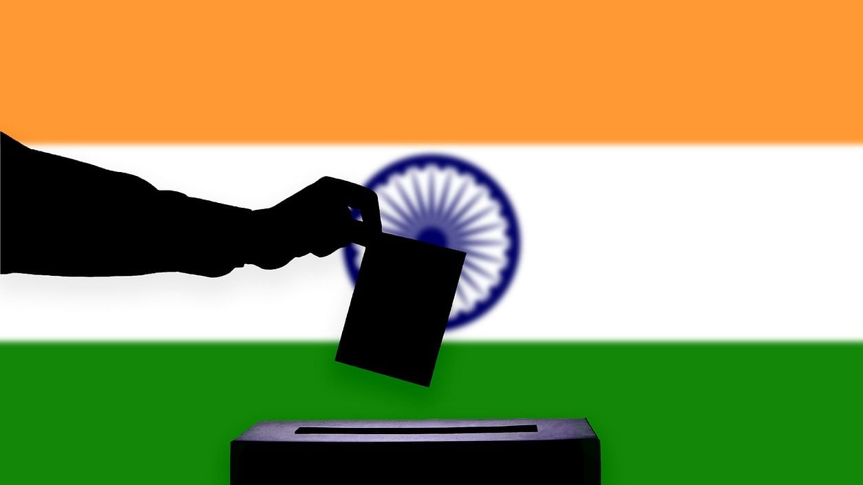 <div class="paragraphs"><p>Representative illustration showing a paper ballot against the Indian flag.</p></div>