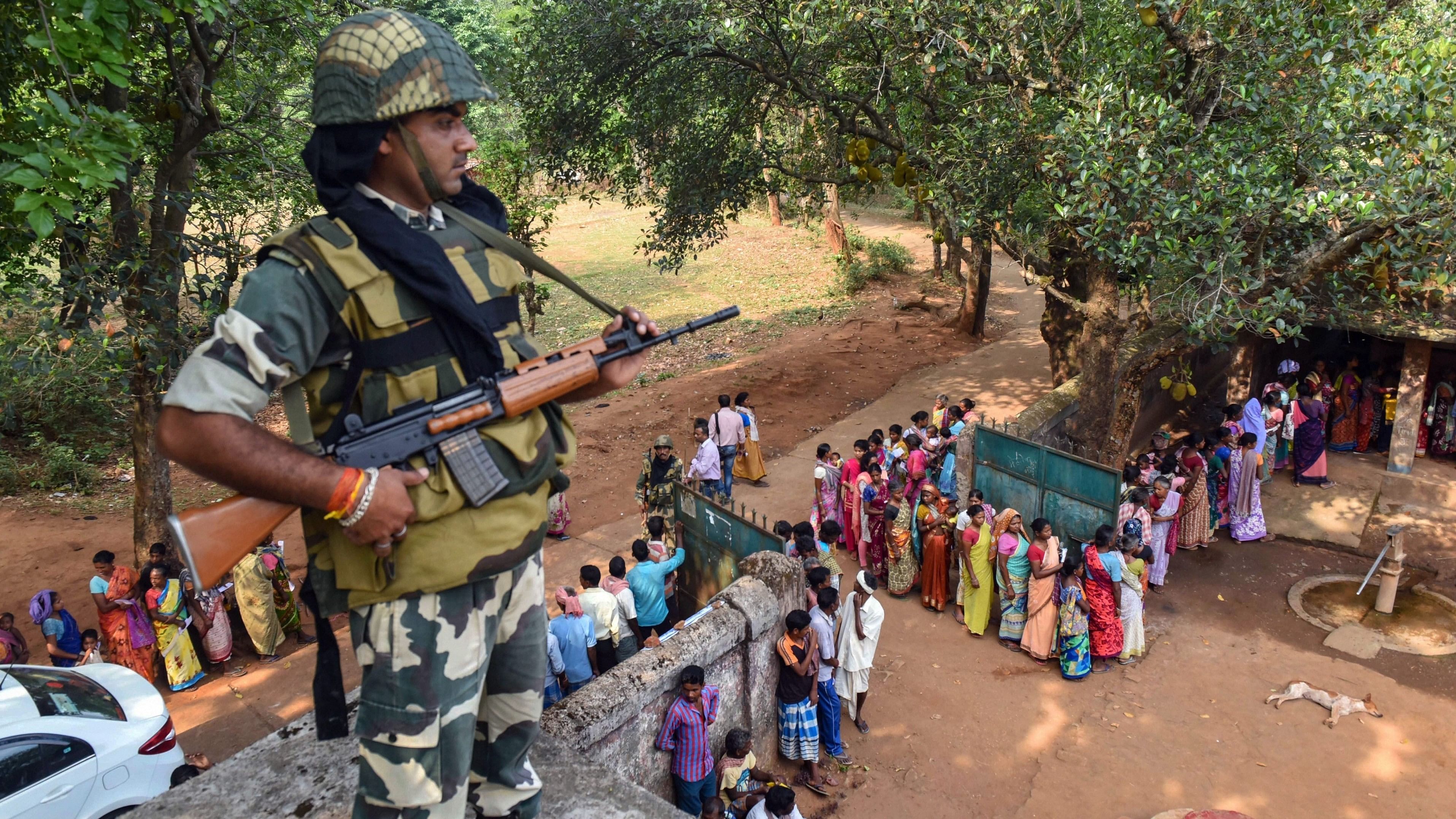 <div class="paragraphs"><p>File photo of a security jawan standing guard as voters wait to cast their votes at a polling station in West Singhbhum district of Jharkhand.&nbsp;</p></div>