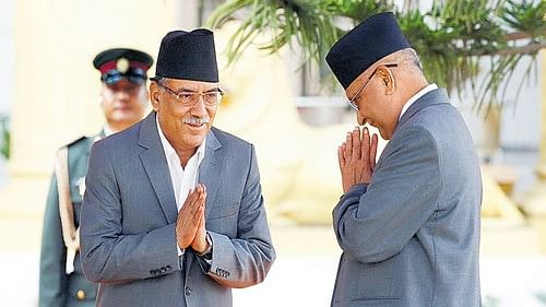 <div class="paragraphs"><p>A file photo of Nepalese Prime Minister Pushpa Kamal Dahal, aka Prachanda, (left) greeting former PM Khadga Prasad Sharma Oli.</p></div>