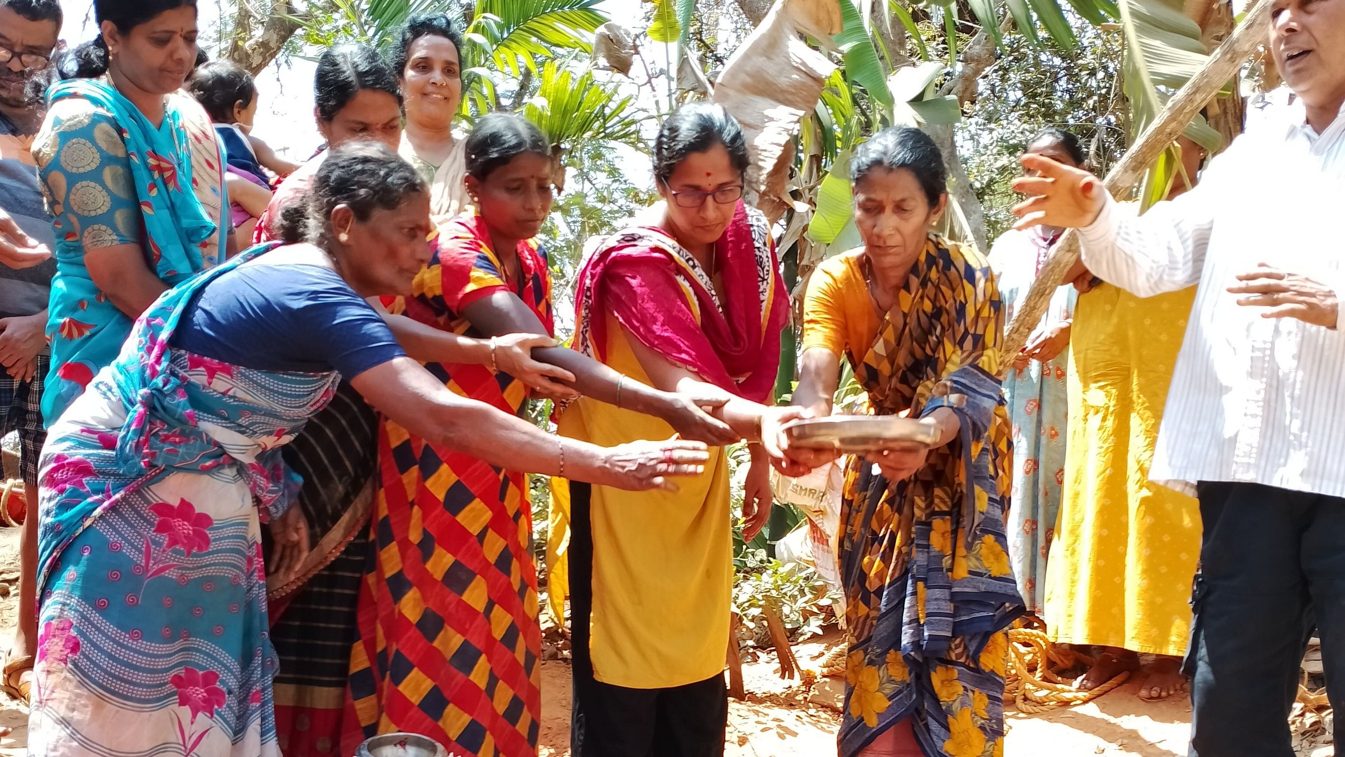 Gowri Naik (first from right) is joined by other women in performing puja to the open well that she dug single-handedly at Sirsi in Uttara Kannada district. 