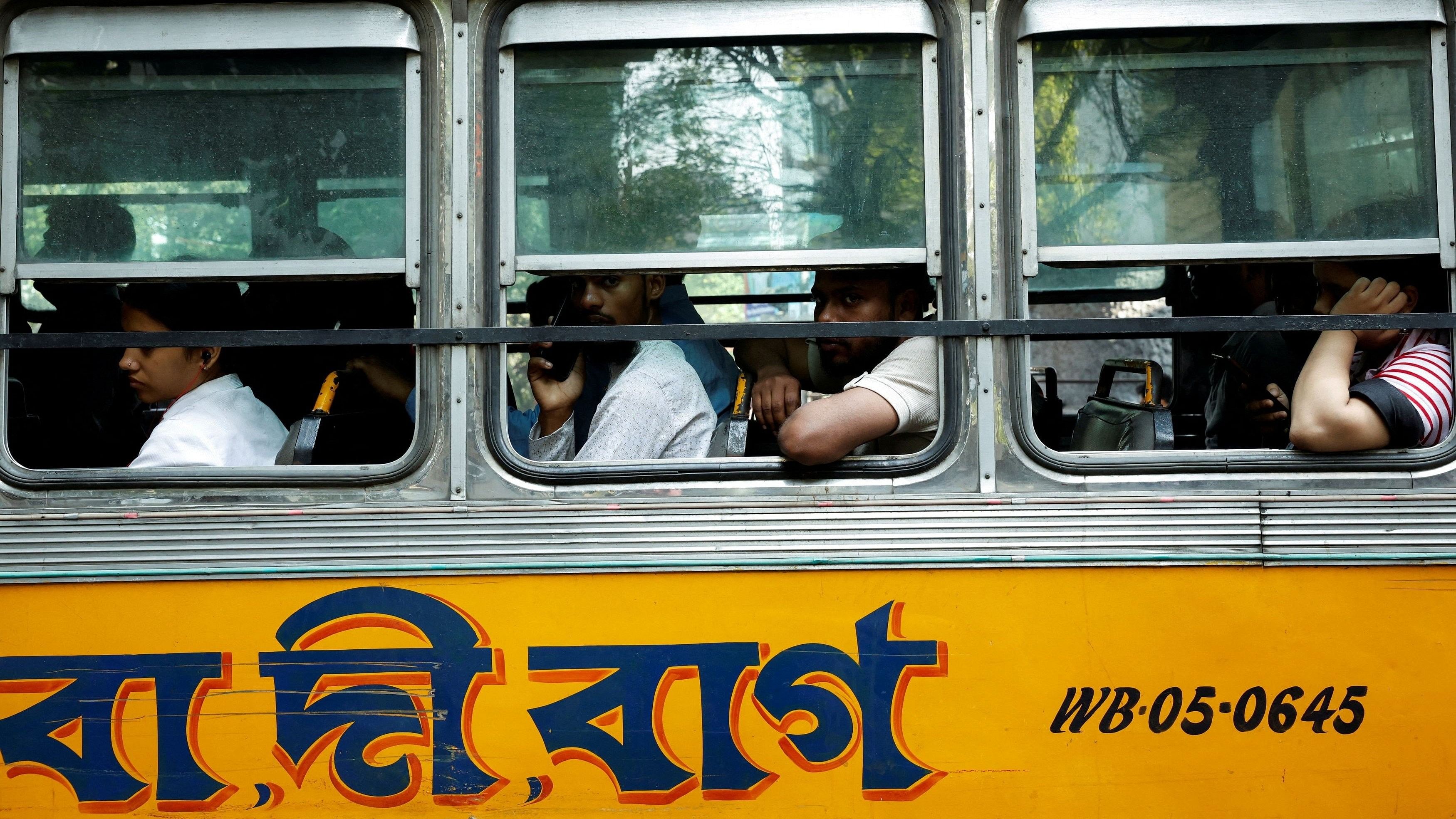 <div class="paragraphs"><p>A photo of people travelling in a local bus in Kolkata, India.</p></div>