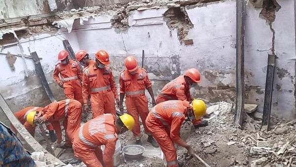 <div class="paragraphs"><p>NDRF personnel during a rescue operation after a two-storey building collapsed at Welcome area, in New Delhi, Thursday, March 21, 2024.</p></div>