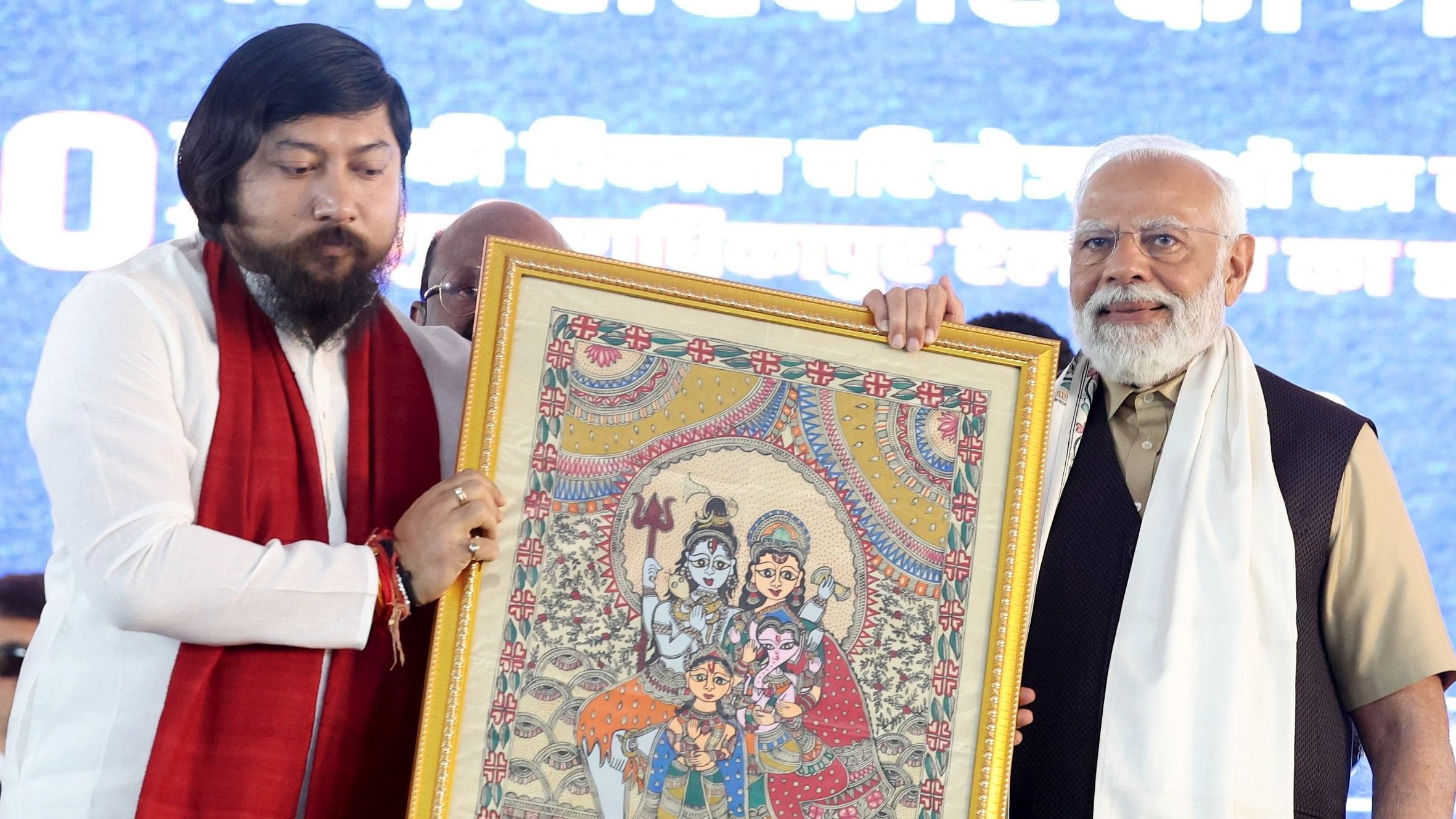 <div class="paragraphs"><p>File Photo: Prime Minister Narendra Modi receives a memento from MoS Nisith Pramanik during the 'Viksit Bharat Viksit West Bengal' programme in Siliguri, Saturday, March 9, 2024. </p></div>
