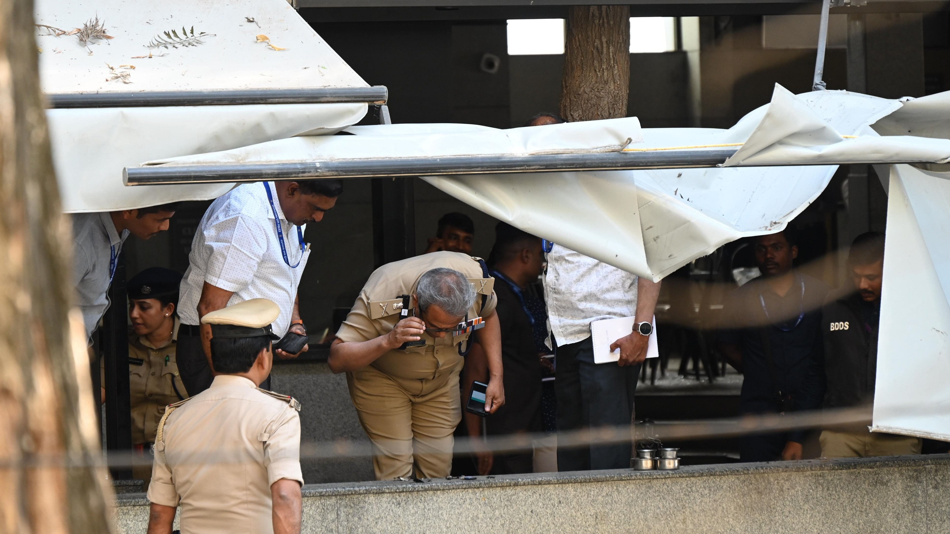 <div class="paragraphs"><p>Police commissioner B Dayananda and Bomb detection &amp; disposal squad examining the spot where an explosion occurred at The Rameshwaram Cafe at Whitefield in Bengaluru on Friday. </p></div>