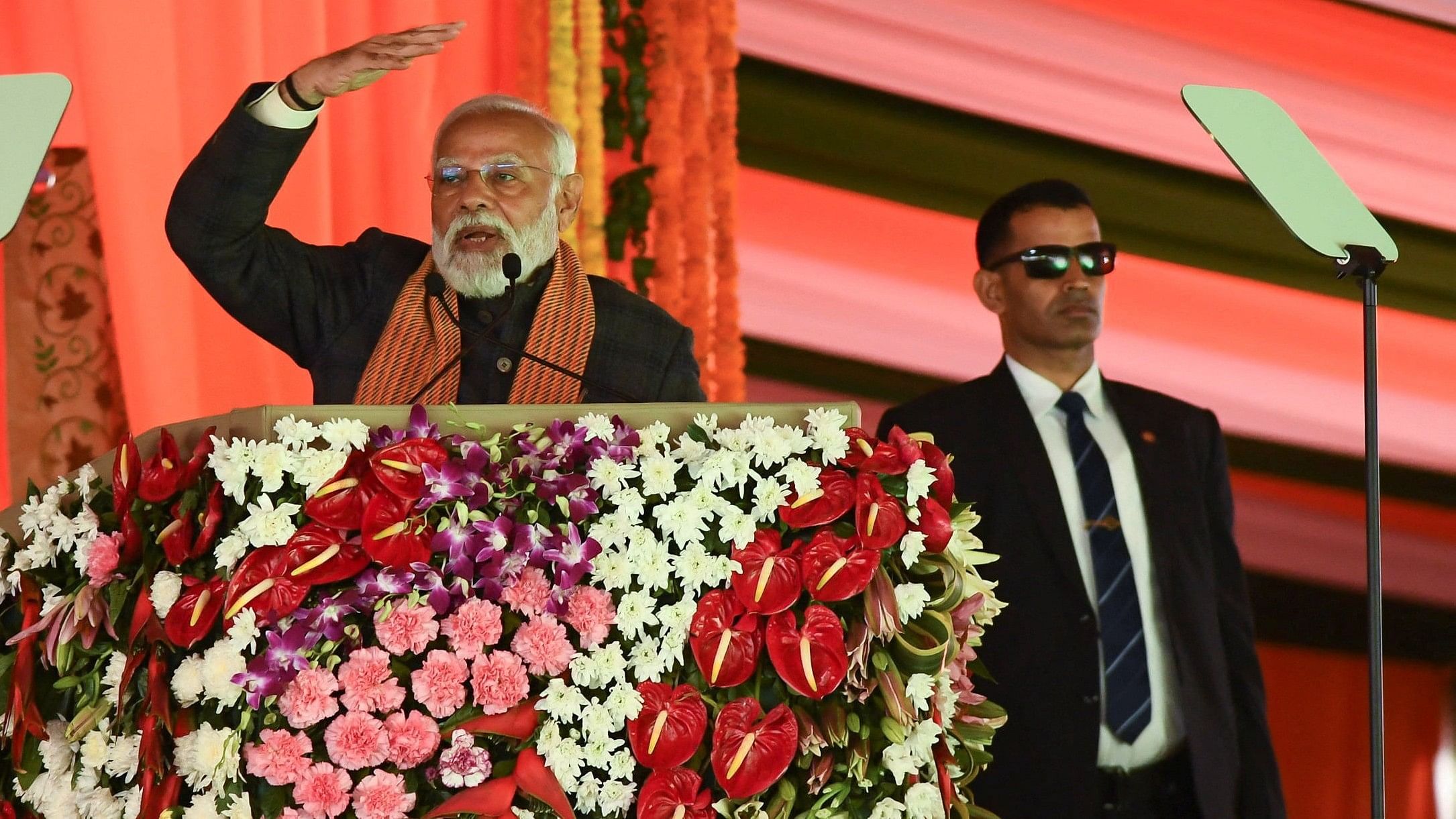 <div class="paragraphs"><p>A photo of Prime Minister Narendra Modi speaking during a rally, as his bodyguard looks on.</p></div>